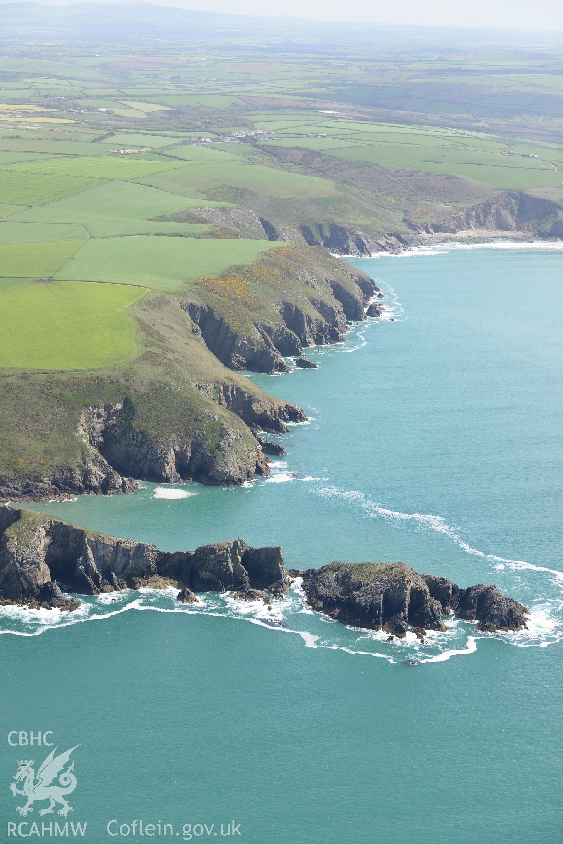 Dinas Fach defended enclosure, Solva. Oblique aerial photograph taken during the Royal Commission's programme of archaeological aerial reconnaissance by Toby Driver on 13th May 2015.