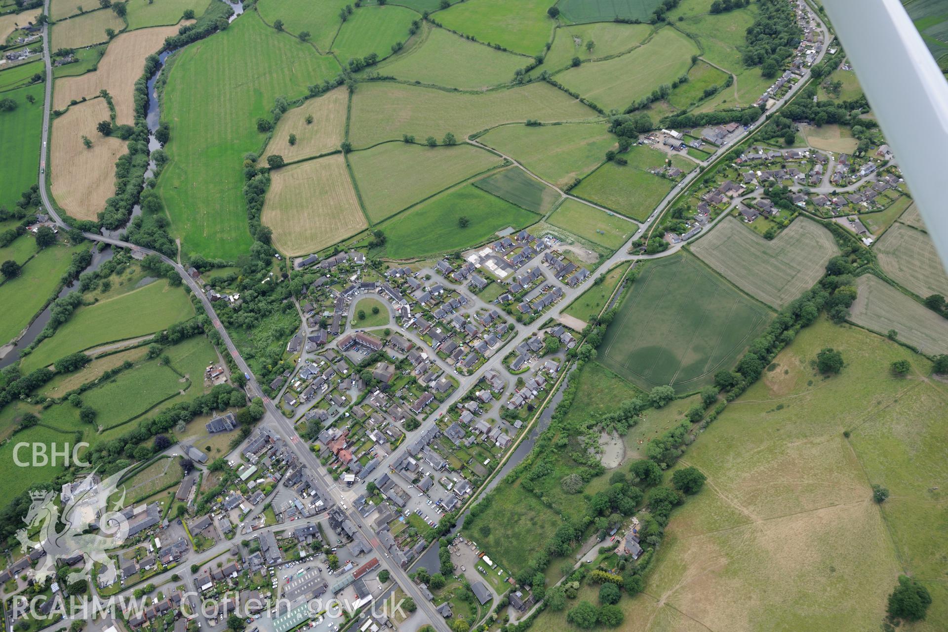 The village of Llanymynech on the Welsh-English border, south west of Oswestry. Oblique aerial photograph taken during the Royal Commission's programme of archaeological aerial reconnaissance by Toby Driver on 30th June 2015.