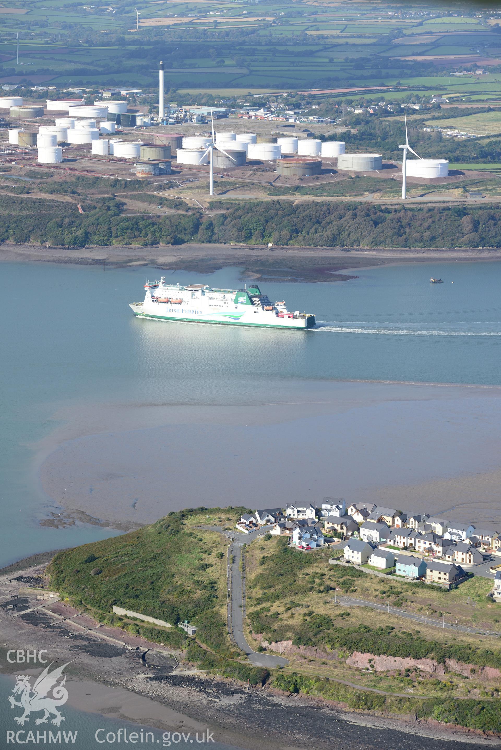 Pillbox, and the Gulf Oil Refinery beyond, at Milford Haven. Oblique aerial photograph taken during the Royal Commission's programme of archaeological aerial reconnaissance by Toby Driver on 30th September 2015.