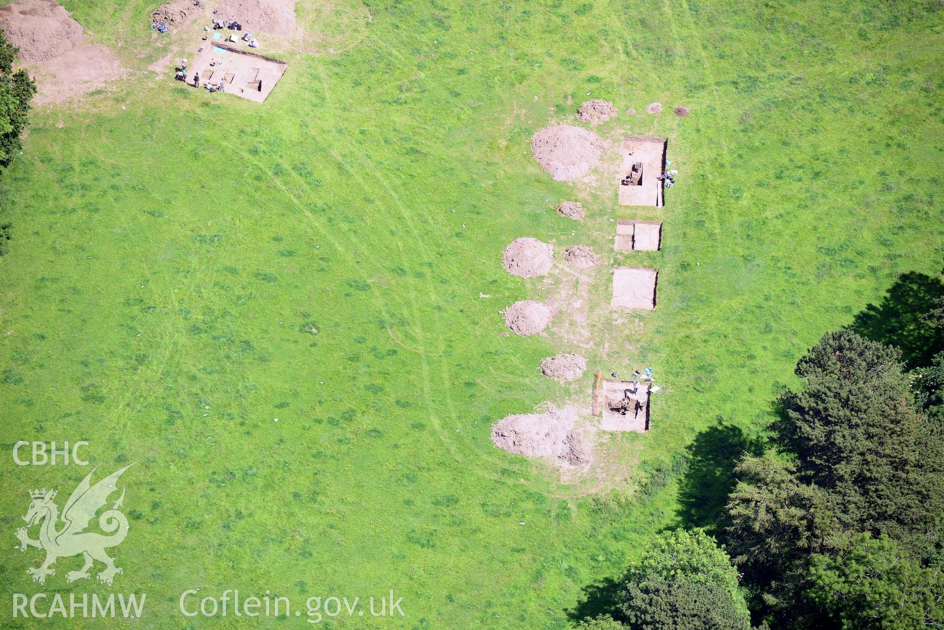 Excavation of Caerau Hillfort, Ely, conducted by Cardiff University. Oblique aerial photograph taken during the Royal Commission's programme of archaeological aerial reconnaissance by Toby Driver on 29th June 2015.