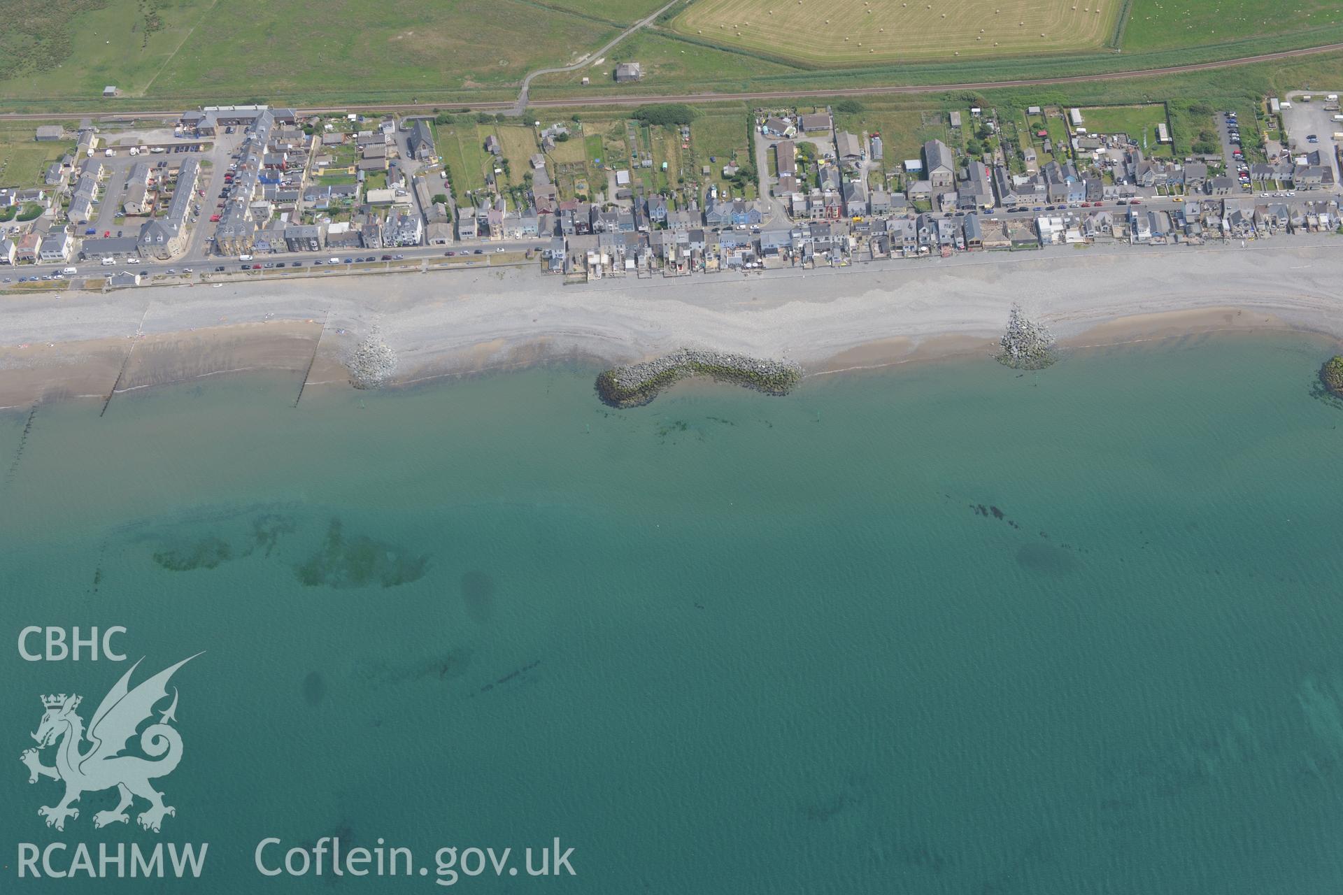 Borth village. Oblique aerial photograph taken during the Royal Commission?s programme of archaeological aerial reconnaissance by Toby Driver on 12th July 2013.