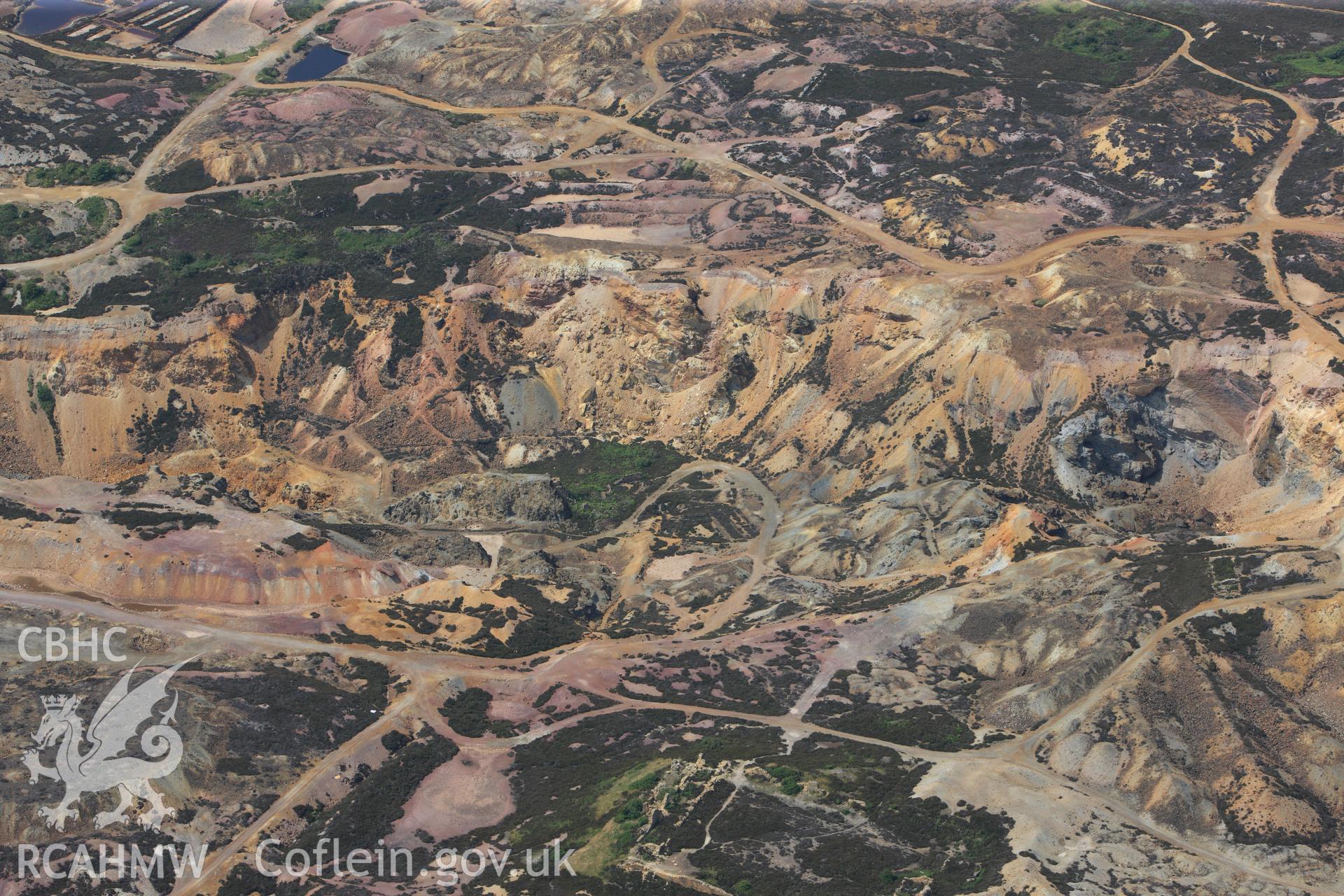 Parys Mountain copper mines, Amlwch, Anglesey. Oblique aerial photograph taken during the Royal Commission?s programme of archaeological aerial reconnaissance by Toby Driver on 12th July 2013.