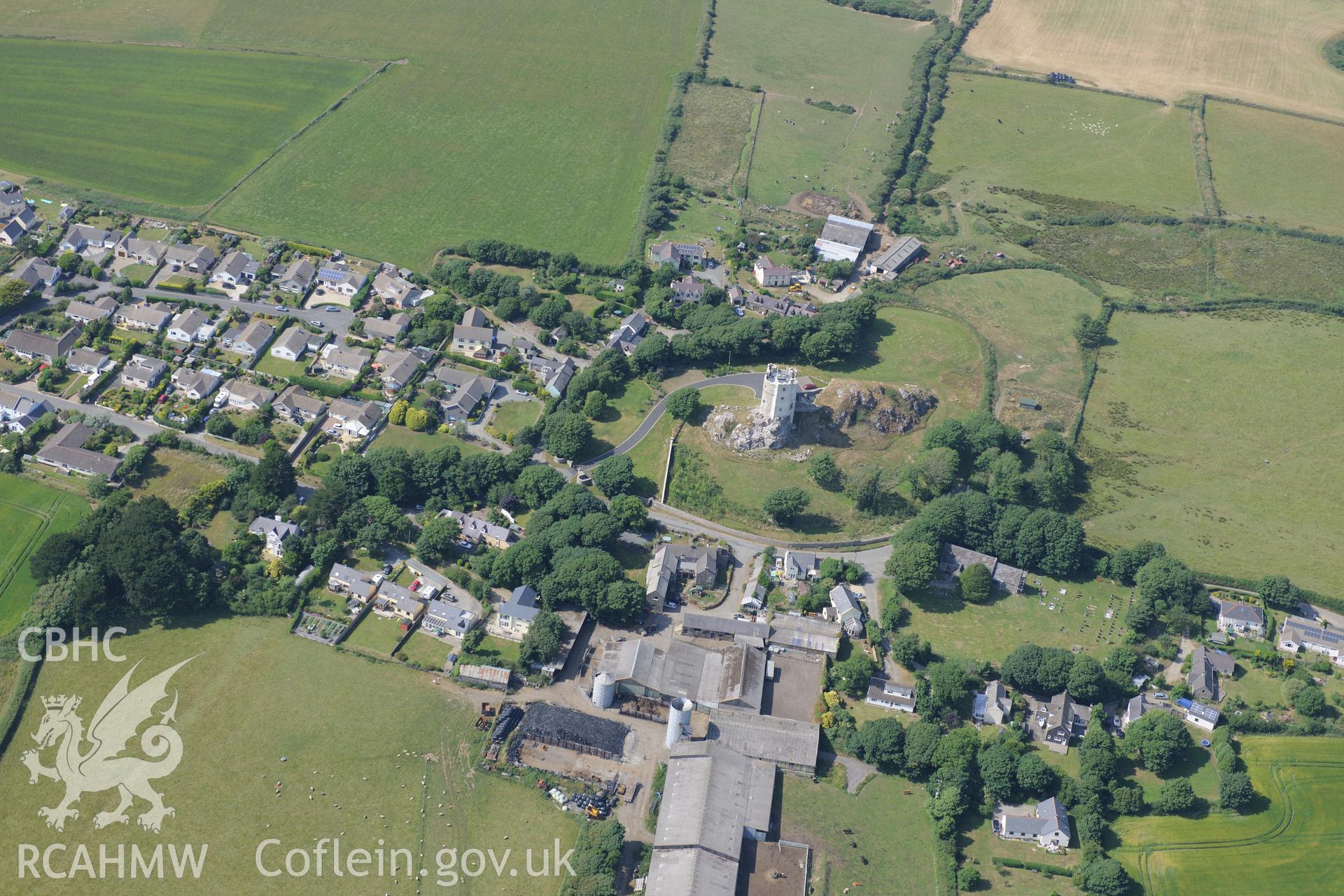 Roch Castle, Castle Farm and St Mary's Church, Roch. Oblique aerial photograph taken during the Royal Commission?s programme of archaeological aerial reconnaissance by Toby Driver on 16th July 2013.