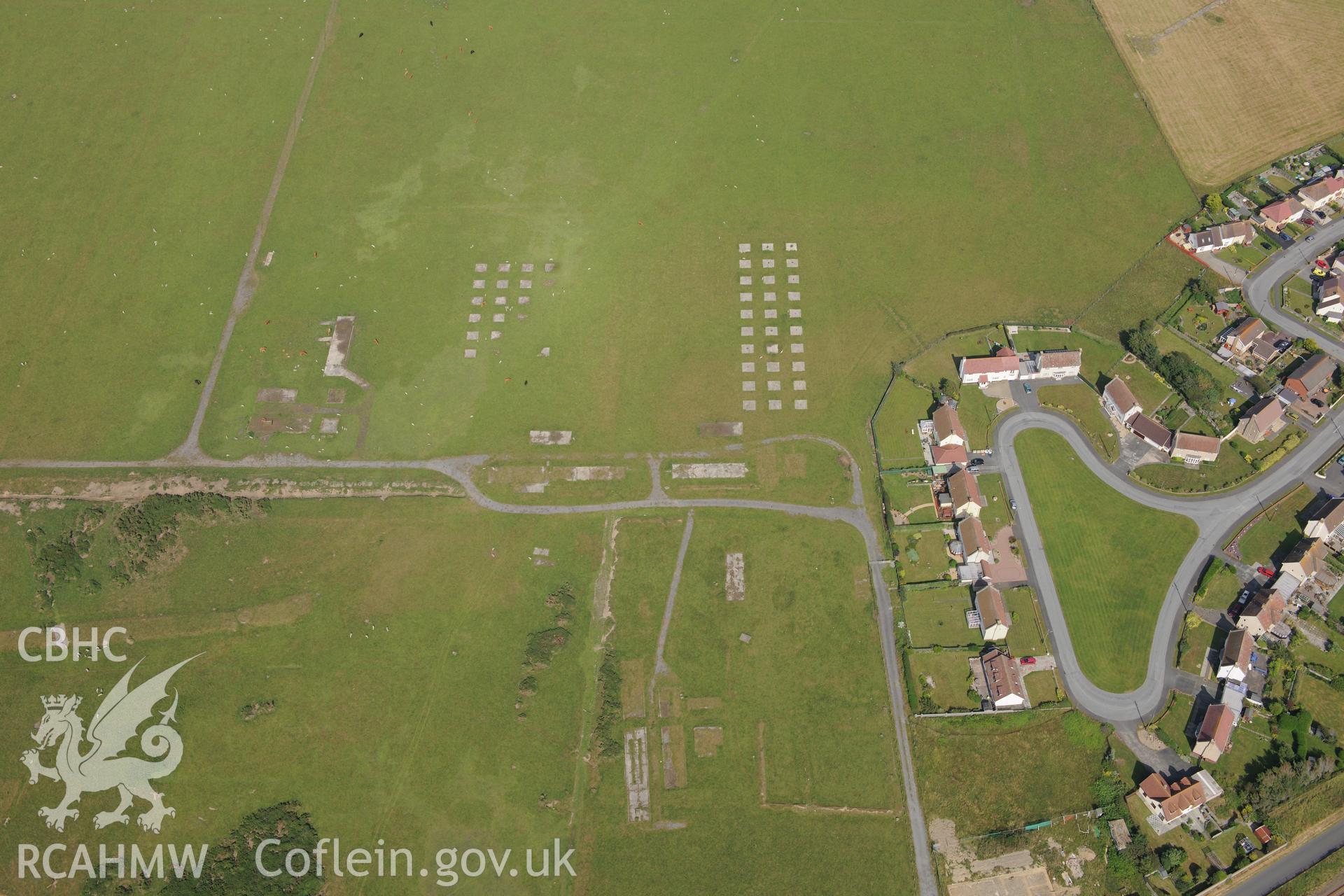 Tywyn airfield, the battle headquarters at Tywyn and the town of Tywyn. Oblique aerial photograph taken during RCAHMW?s programme of archaeological aerial reconnaissance by Toby Driver, 12th July 2013.