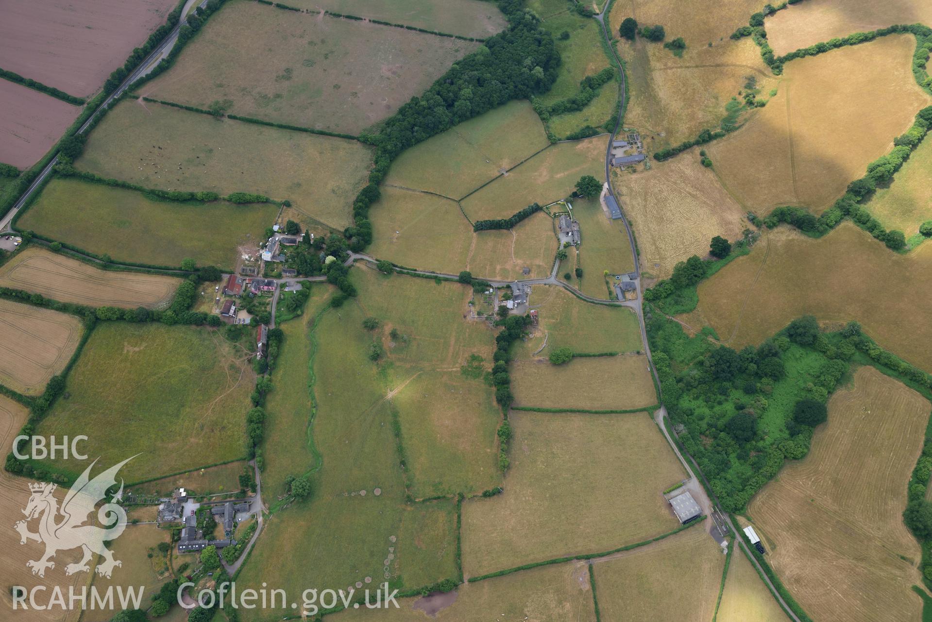 Royal Commission aerial photography of extensive parchmarks at Pen y Gaer Roman fort, including the internal plan and extramural buildings, taken on 19th July 2018 during the 2018 drought.