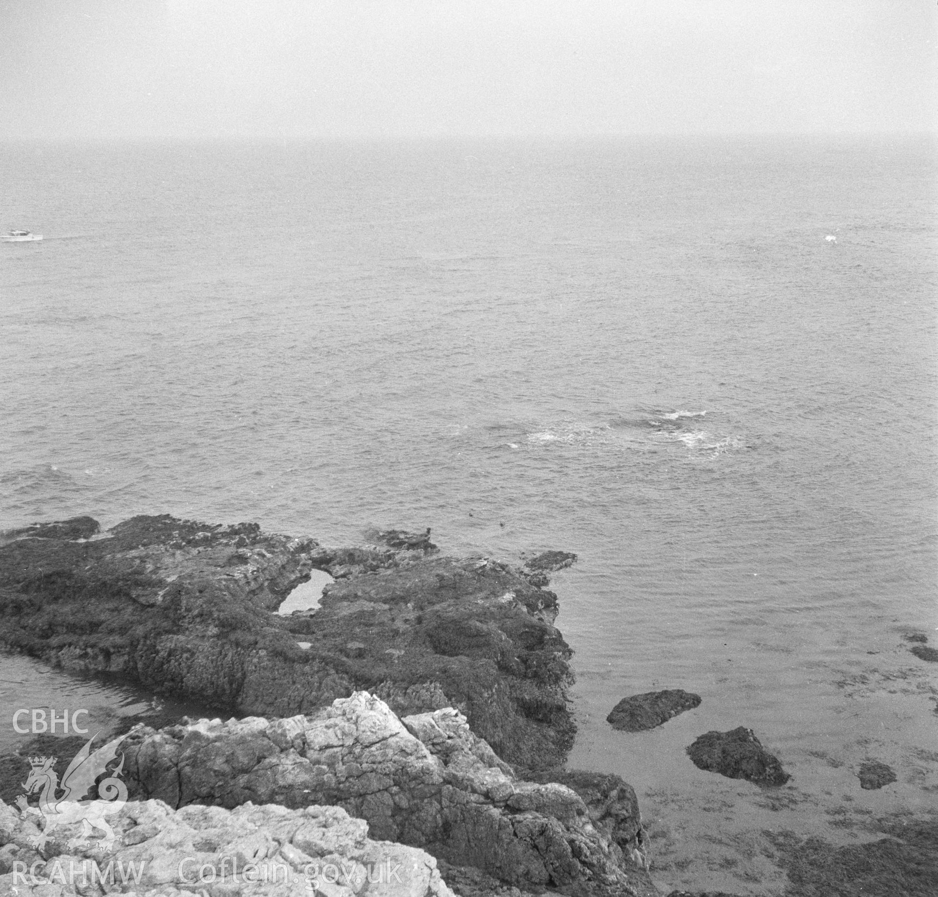 Digital copy of a black and white negative showing Puffin Island coastal view.