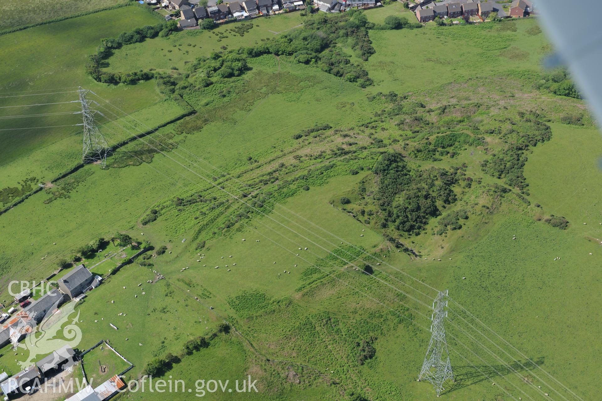 Pen-y-Castell defended enclosure or hillfort. Oblique aerial photograph taken during the Royal Commission's programme of archaeological aerial reconnaissance by Toby Driver on 19th June 2015.