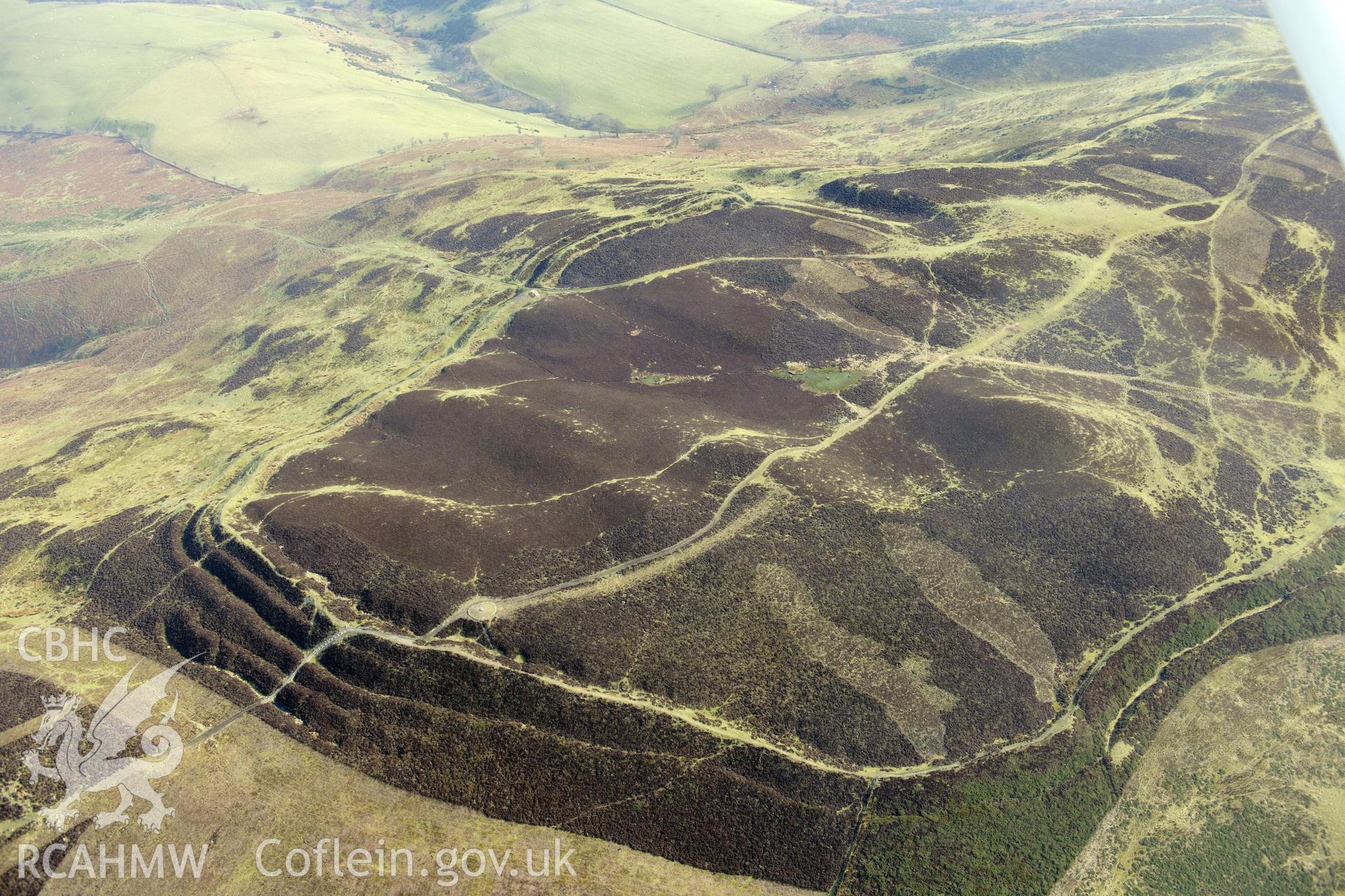 Penycloddiau hillfort and cairn, Llangwyfan. Oblique aerial photograph taken during the Royal Commission?s programme of archaeological aerial reconnaissance by Toby Driver on 28th February 2013.