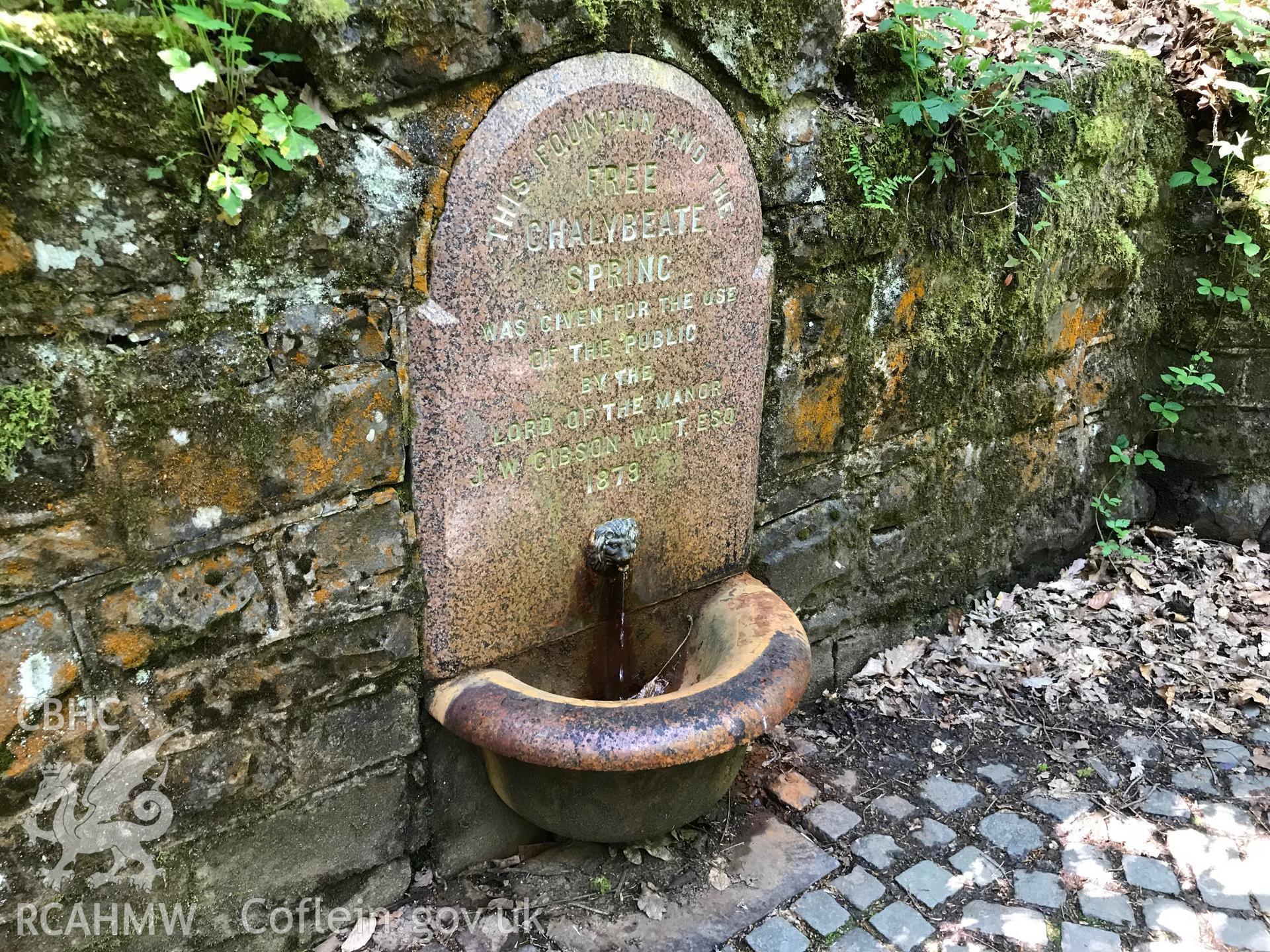 Colour photo showing detail of chalybeate spring at Rock Park spa centre pavilion, Llandrindod Wells, taken by Paul R. Davis, 19th May 2018. Transcription: THIS FOUNTAIN AND THE FREE CHALYBEATE SPRING WAS GIVEN FOR THE USE OF THE PUBLIC BY THE LORD OF THE MANOR J. W. GIBSON WATT ESQ 1879.