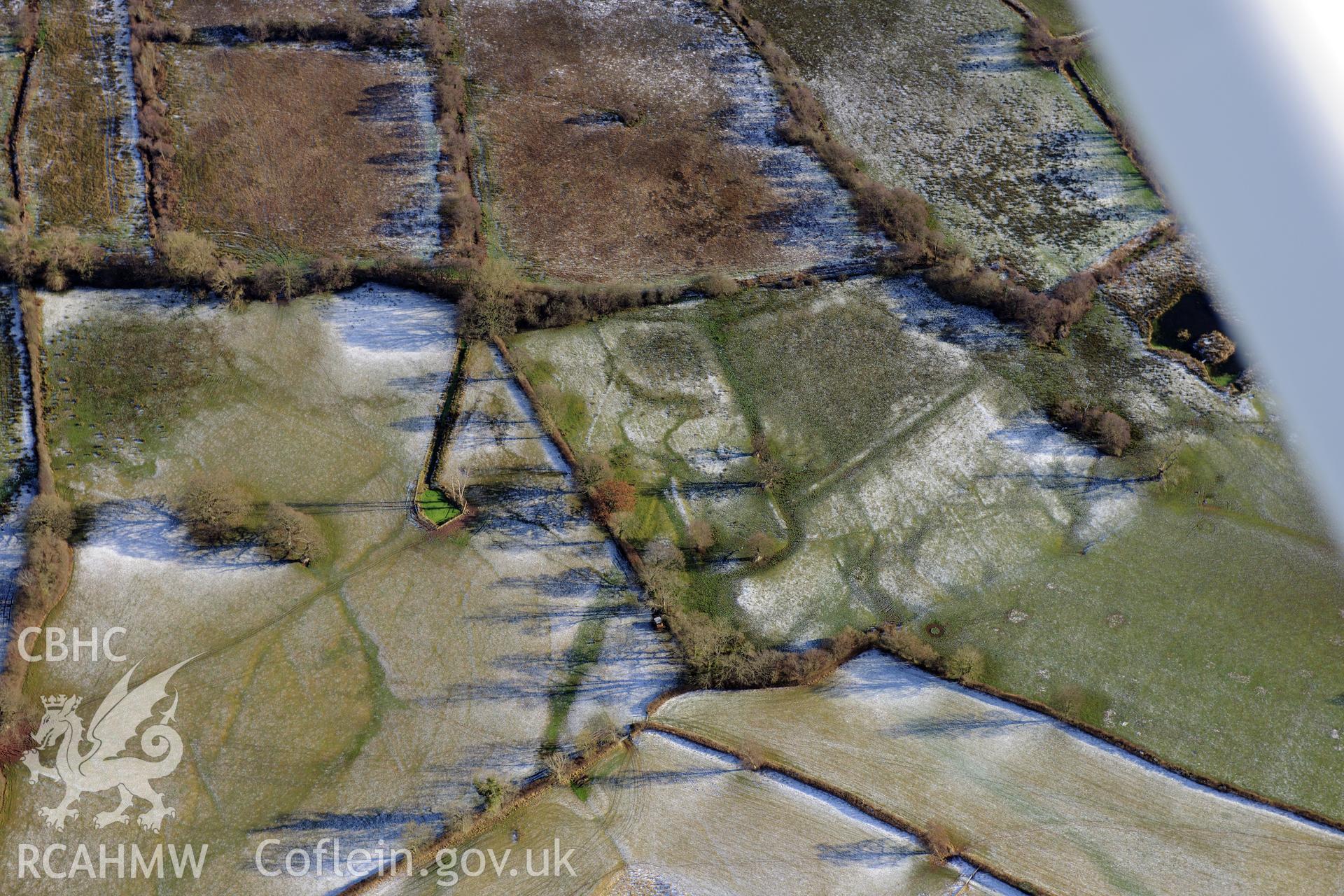 The village of Llangasty-Talyllyn and surrounding fields, south east of Brecon. Oblique aerial photograph taken during the Royal Commission?s programme of archaeological aerial reconnaissance by Toby Driver on 15th January 2013.
