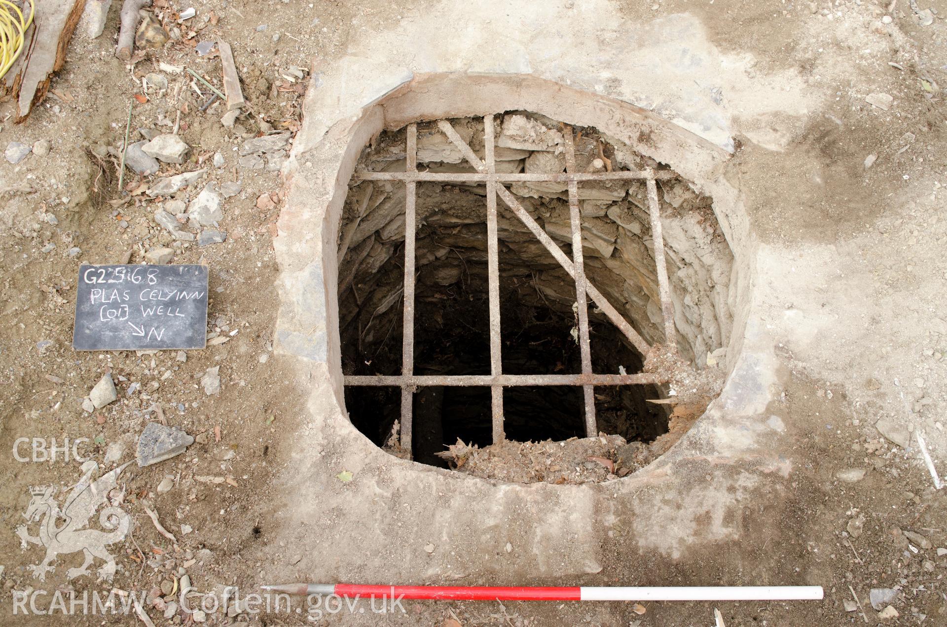 'Top of well with grating, view from the north north east.' Photographed by Gwynedd Archaeological Trust as part of archaeological mitigation report for well at Plas Celynin, Henryd, Conwy, on 1st August 2018. Project no. G2568.