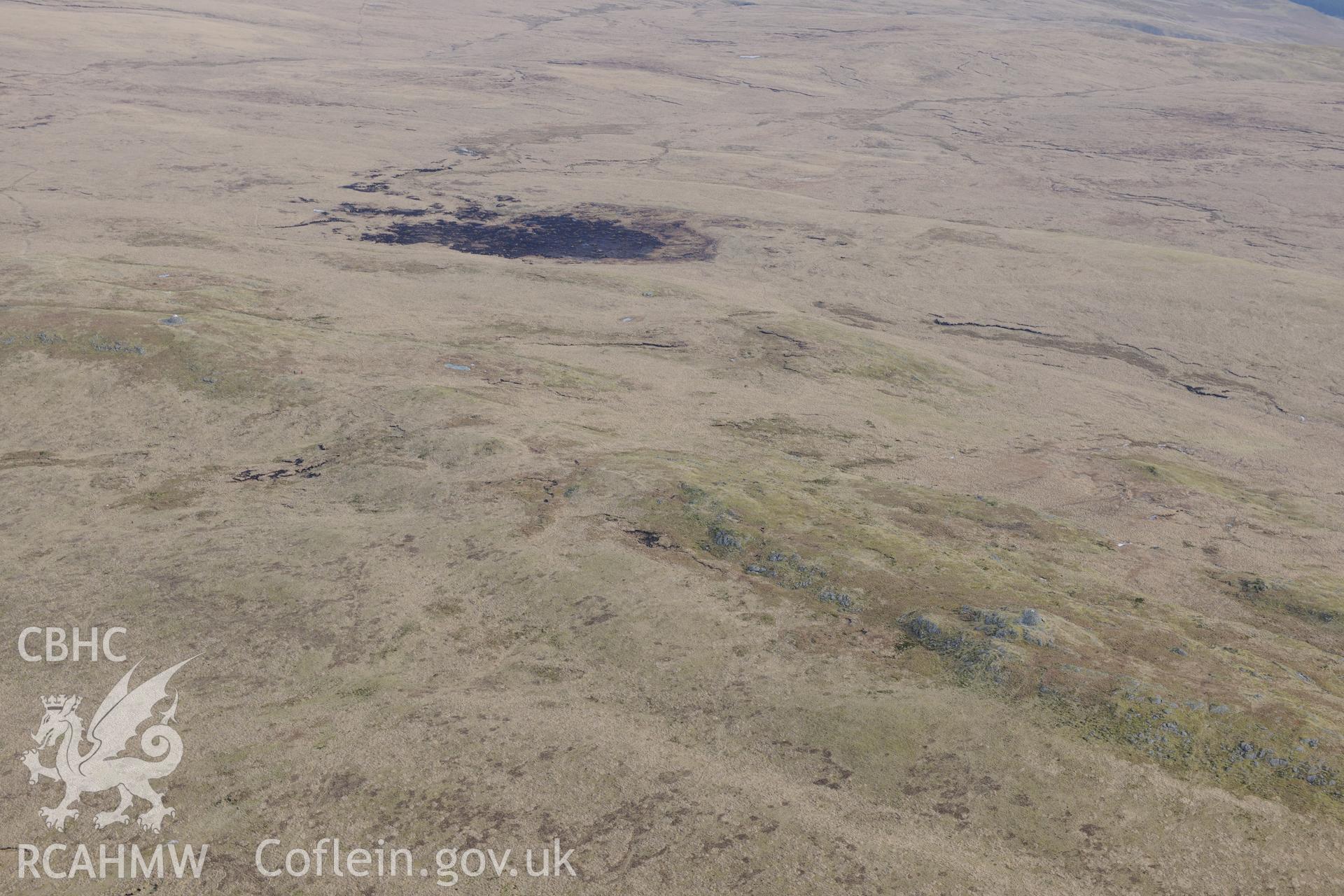 Drygan Fawr West cairn, in the Cambrian Mountains west of Llandrindod Wells. Oblique aerial photograph taken during the Royal Commission?s programme of archaeological aerial reconnaissance by Toby Driver on 28th February 2013.