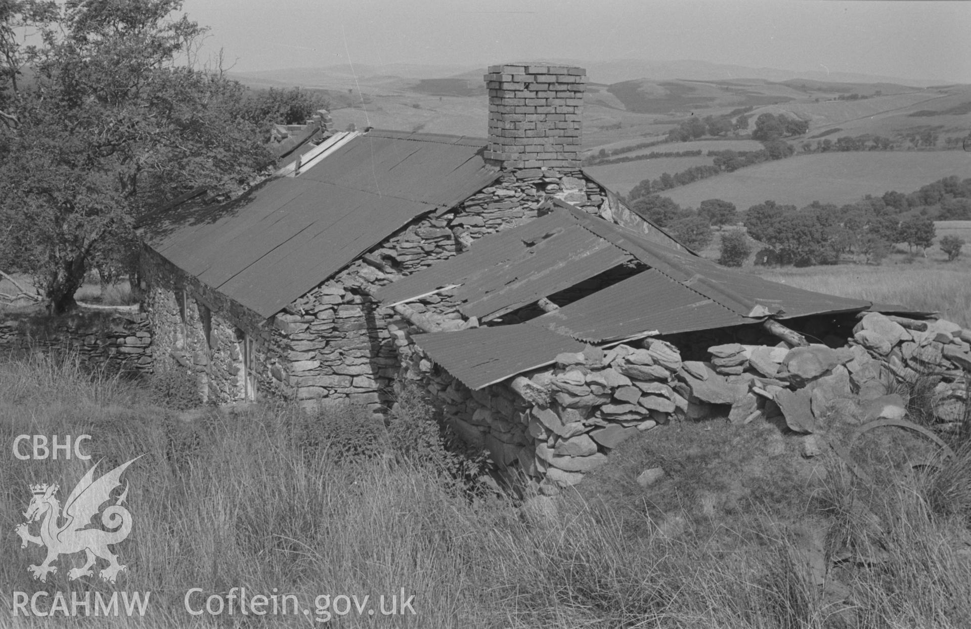 Digital copy of a black and white negative showing view of Ty-Newydd ruin (at 1,050 ft.) near Afon Fflur, Ystrad Fflur, part of the Bryneithinog squatter settlement. Photographed by Arthur O. Chater in August 1967. Looking north from Grid Reference SN 7331 6314.