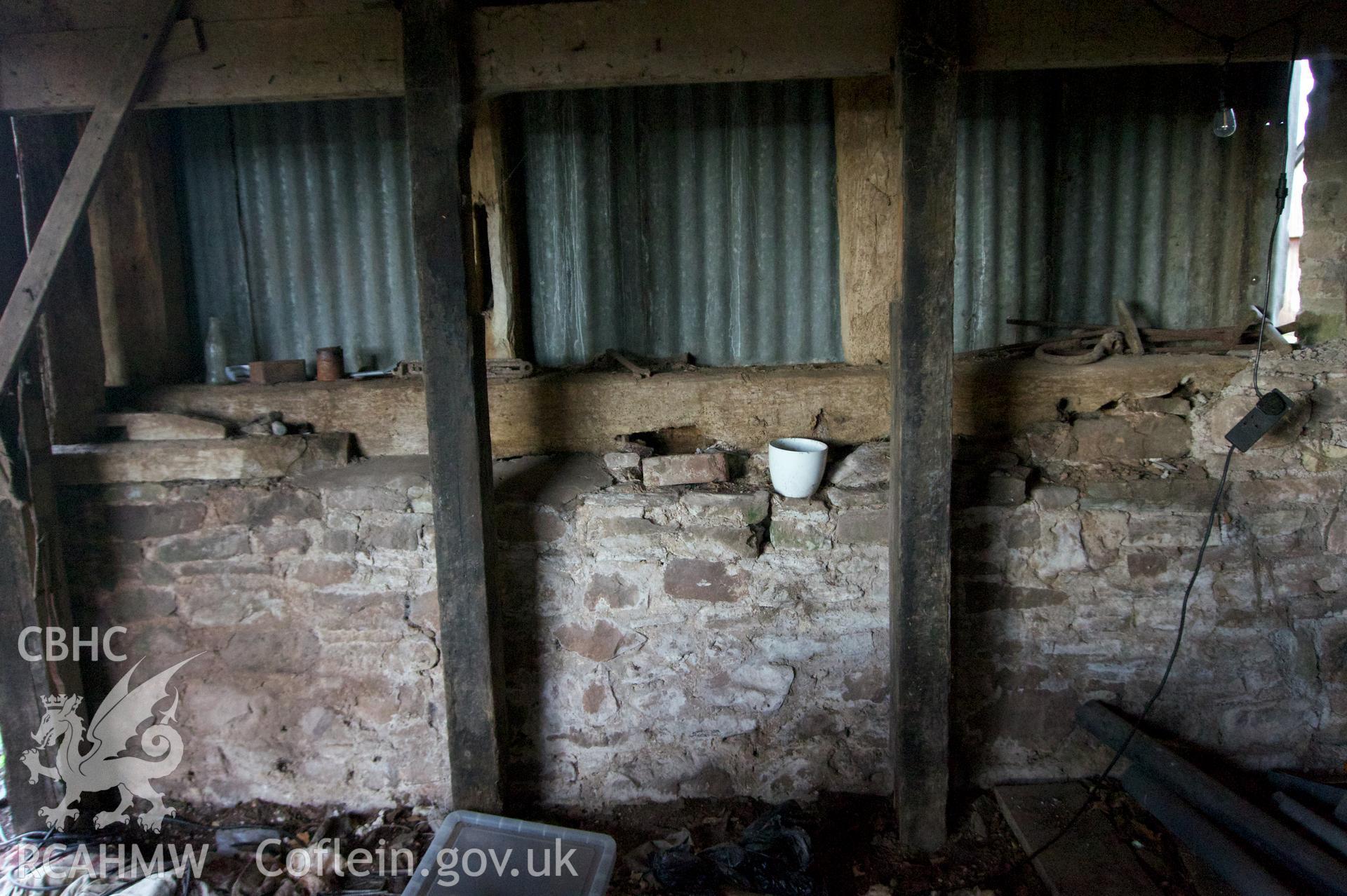 Inside of north wall beneath mezzanine at Middle Ton Threshing Barn. Photographed for Historic Building Photographic Record of Middle Ton Threshing Barn, Llanvapley, by Dan Courtney of Cog Architects, 2019.