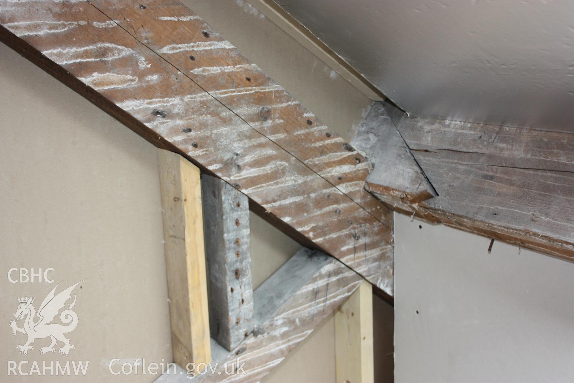 Colour photograph showing detail of the Queen strut truss at the attic level of the Old Auction Rooms/ Liberal Club in Aberystwyth. Photographic survey conducted by Geoff Ward on 9th June 2010 during repair work prior to conversion into flats.