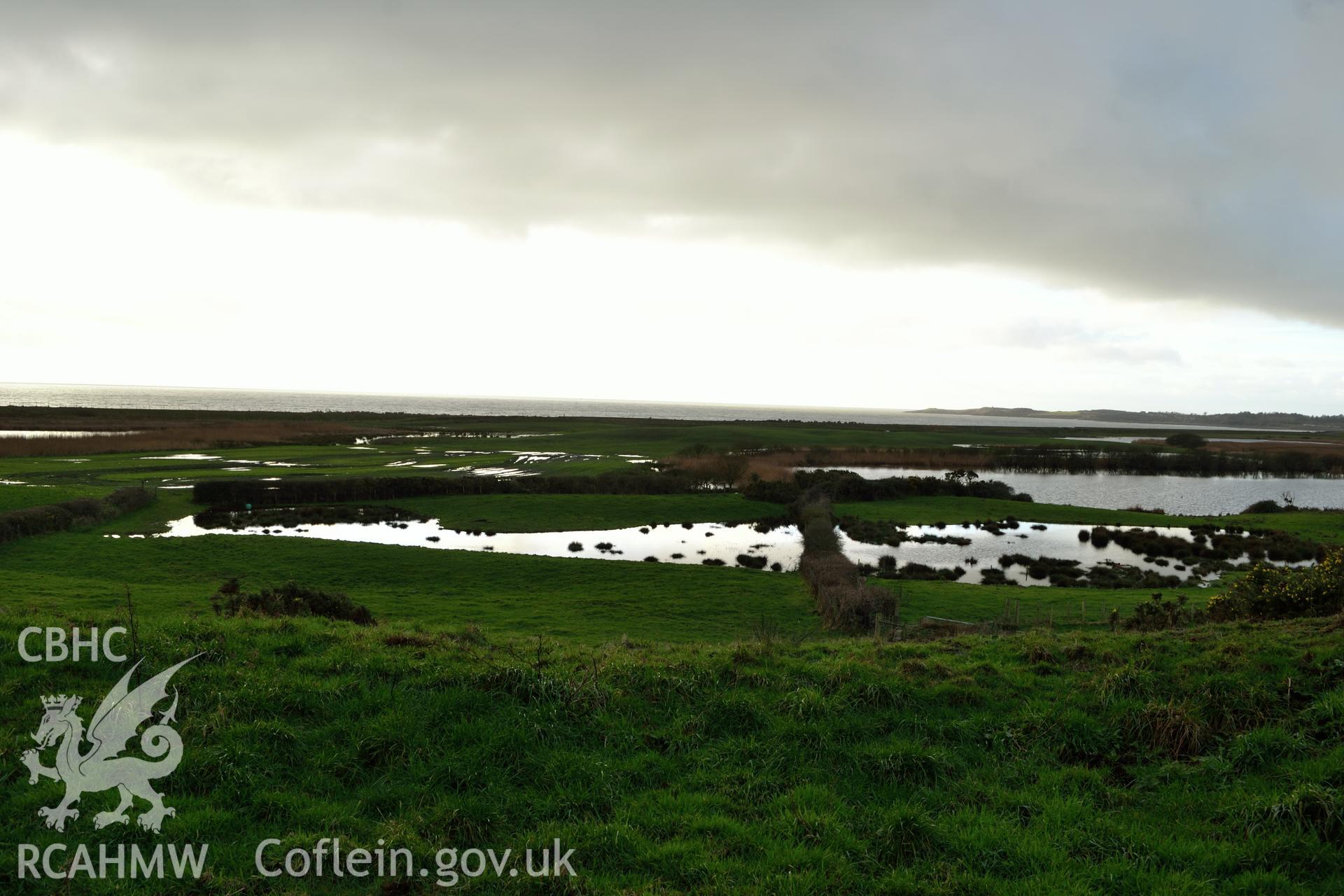 View of salt marsh and Cardigan Bay from south edge of Tomen Fawr. Photographed by Gwynedd Archaeological Trust during impact assessment of the site on 20th December 2018. Project no. G2564.