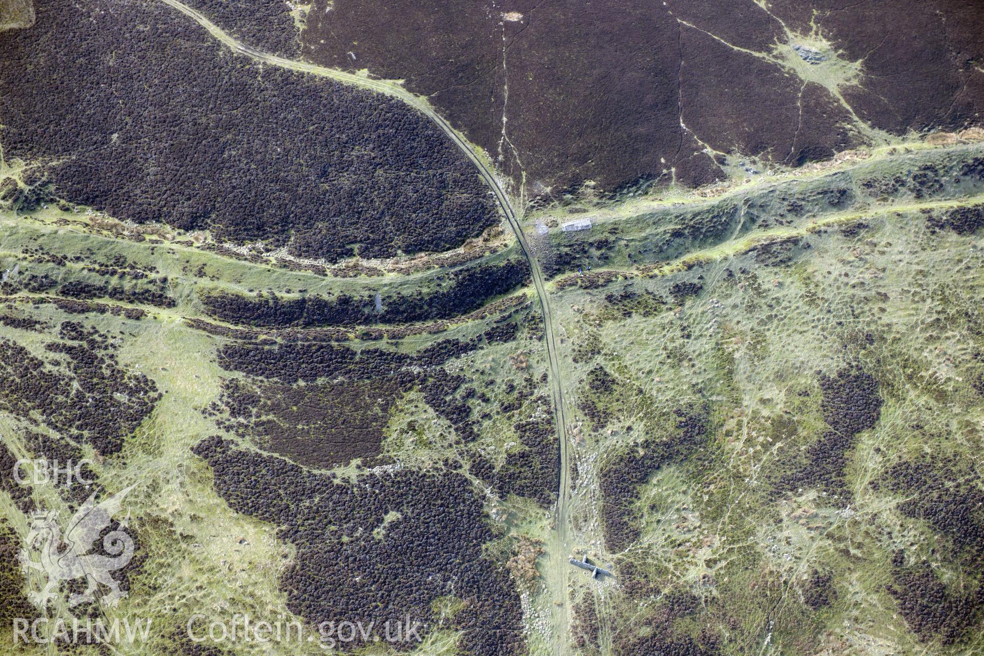 Main east gate at Penycloddiau hillfort, Llangwyfan. Oblique aerial photograph taken during the Royal Commission?s programme of archaeological aerial reconnaissance by Toby Driver on 28th February 2013.