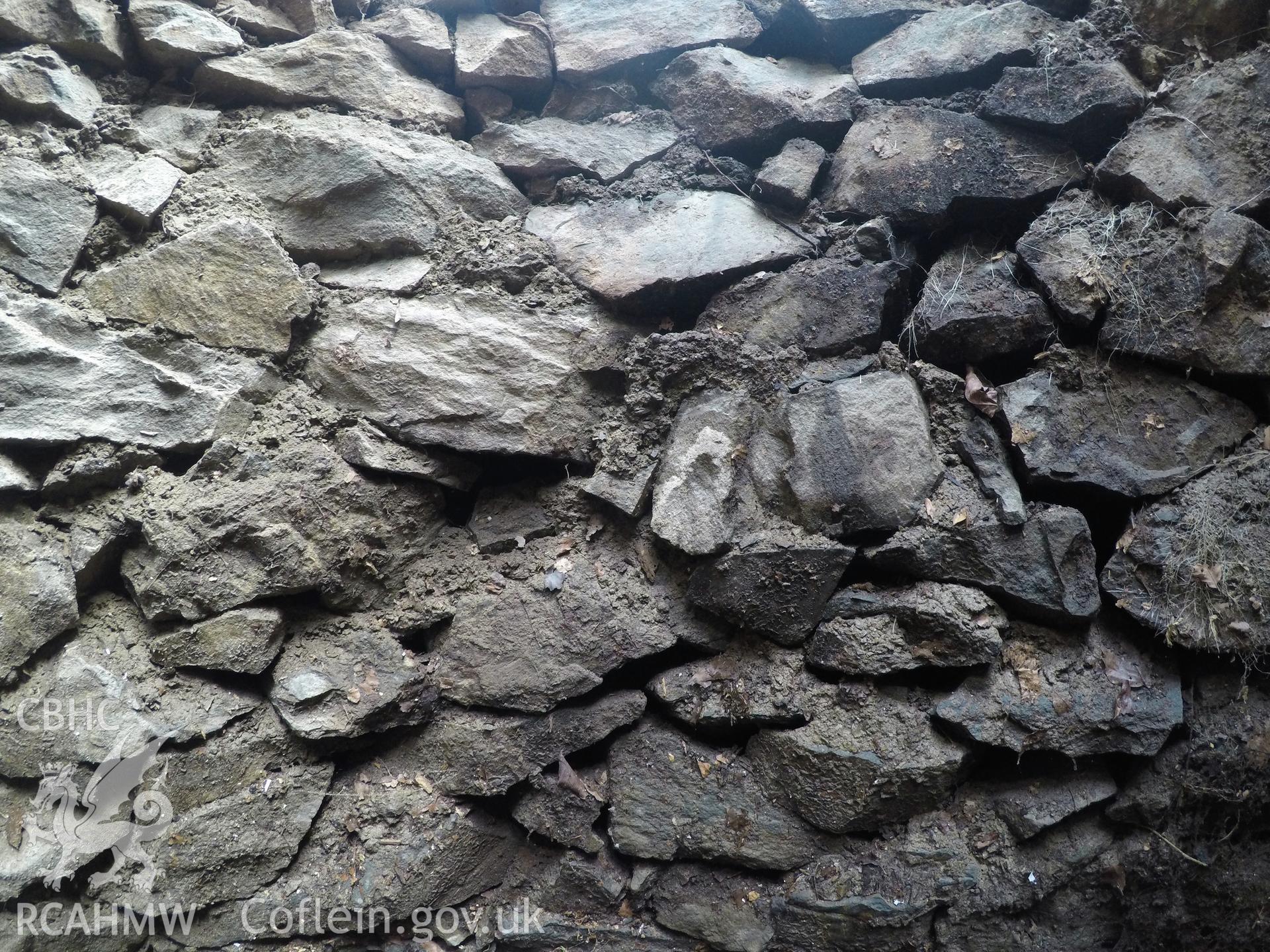 View from north of well interior at 1.0m depth. Photographed by Gwynedd Archaeological Trust as part of archaeological mitigation report for well at Plas Celynin, Henryd, Conwy, on 1st August 2018. Project no. G2568.