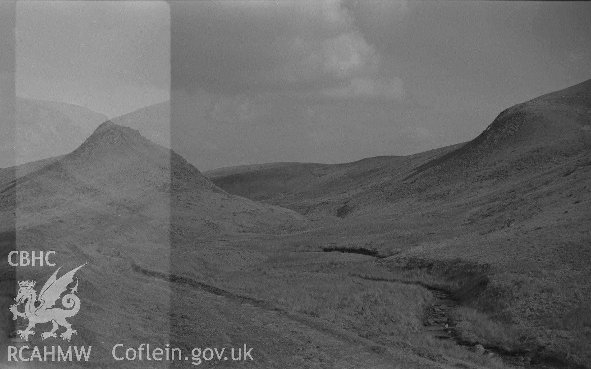 Black and White photograph showing view up the old track on the north side of Groes Fawr. Photographed by Arthur Chater in April 1962 from Grid Reference SN 728 598, looking south east.