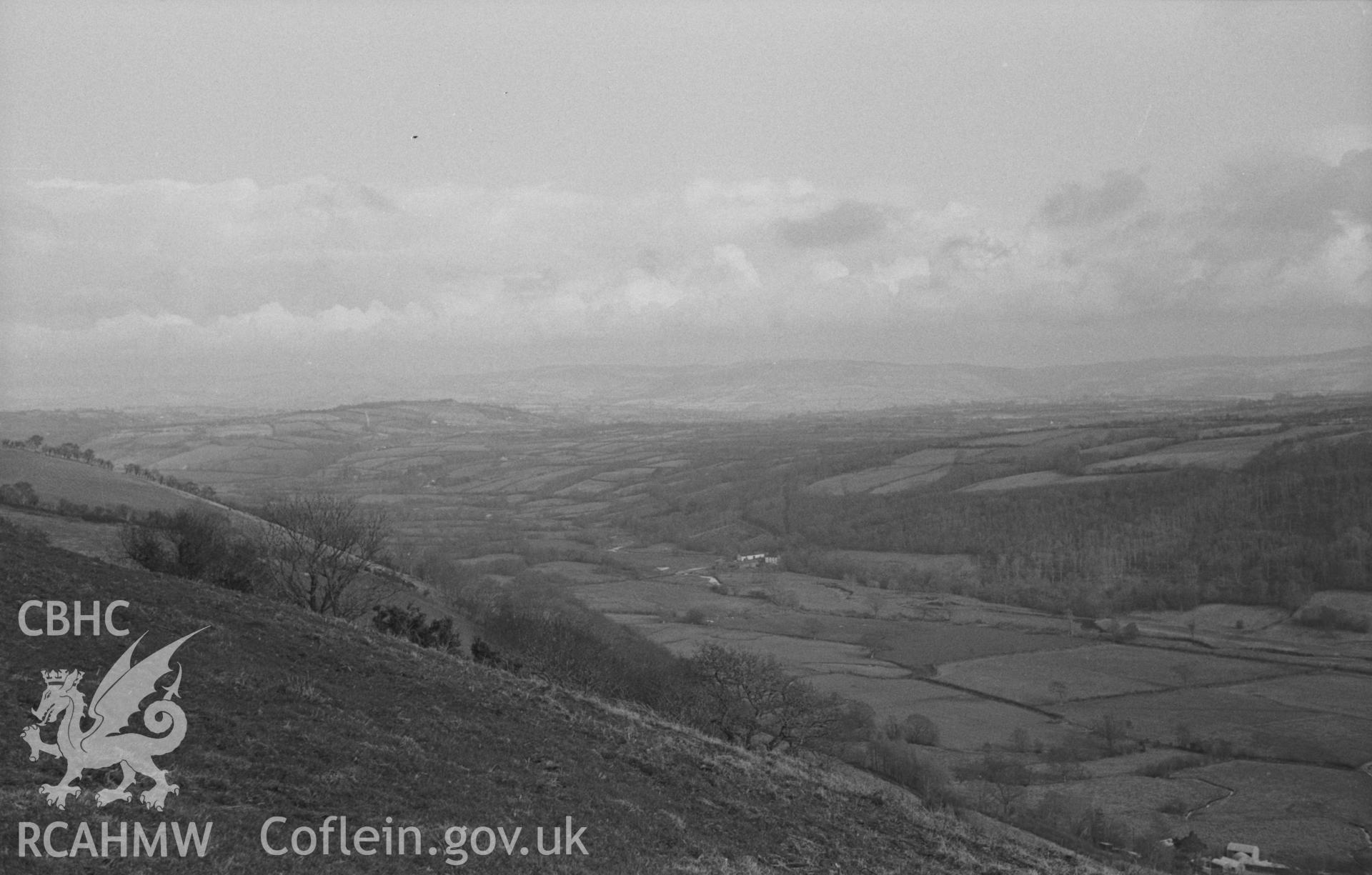 Black and White photograph showing view from Pen-y-Gaer, Nantcwnlle, up the Aeron Valley - Dolau farm is on the right in centre. Photographed by Arthur Chater in April 1963 from Grid Reference SN 577 583, looking east north east.