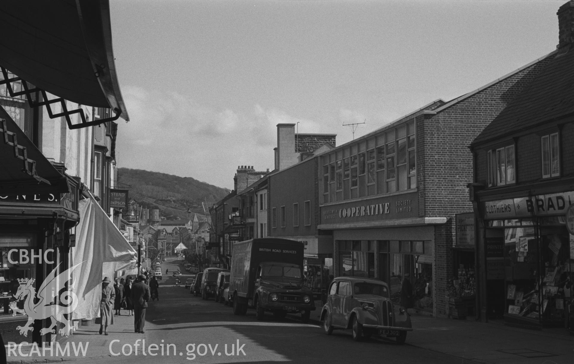 Black and White photograph showing view looking down Great Darkgate Street from the corner of Market Street, Aberystwyth. Photographed by Arthur Chater, March 1961. Taken from grid reference: SN 5827 8165, looking north east.