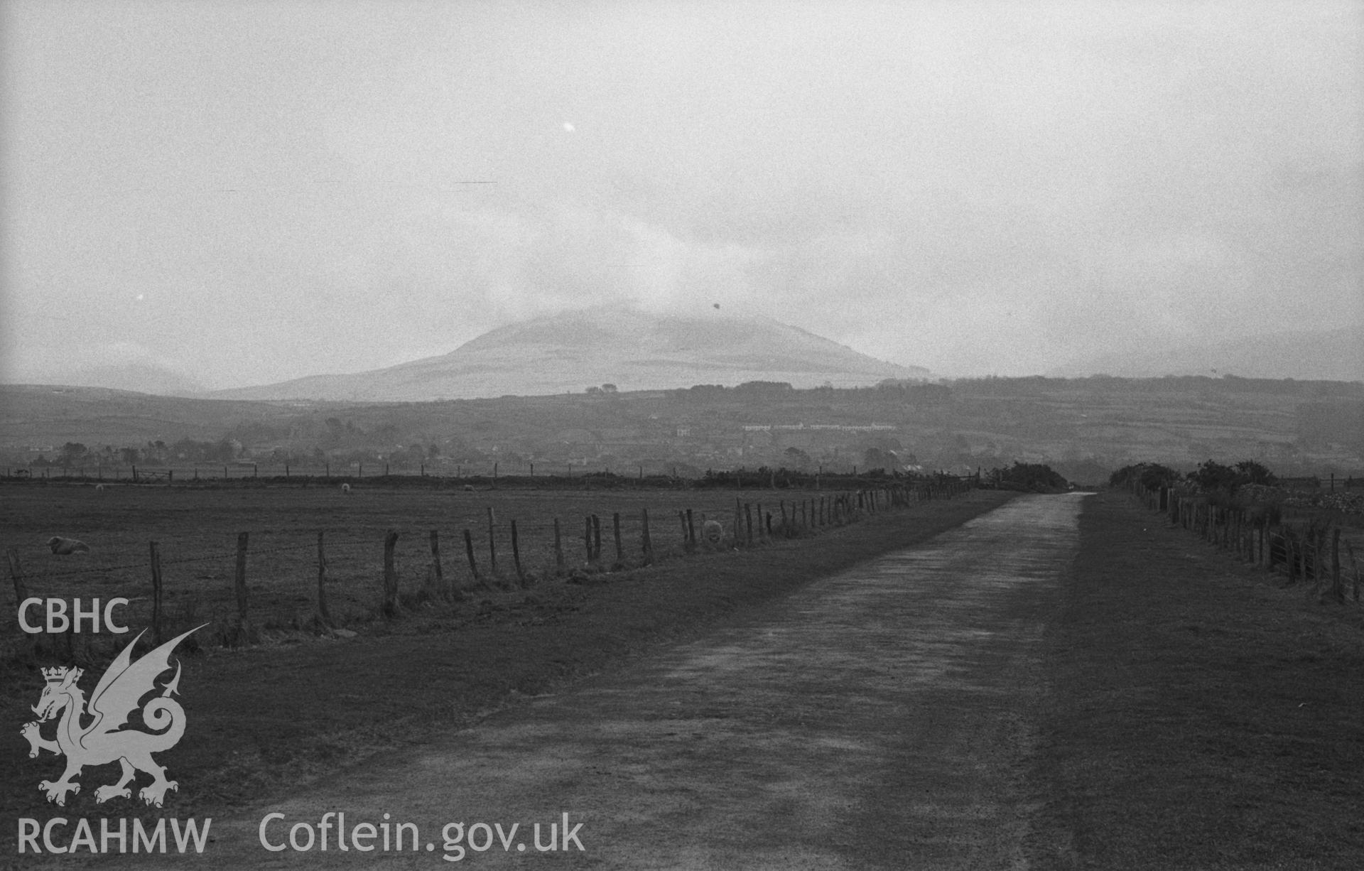 Black and White photograph showing distant view of Moelfre.