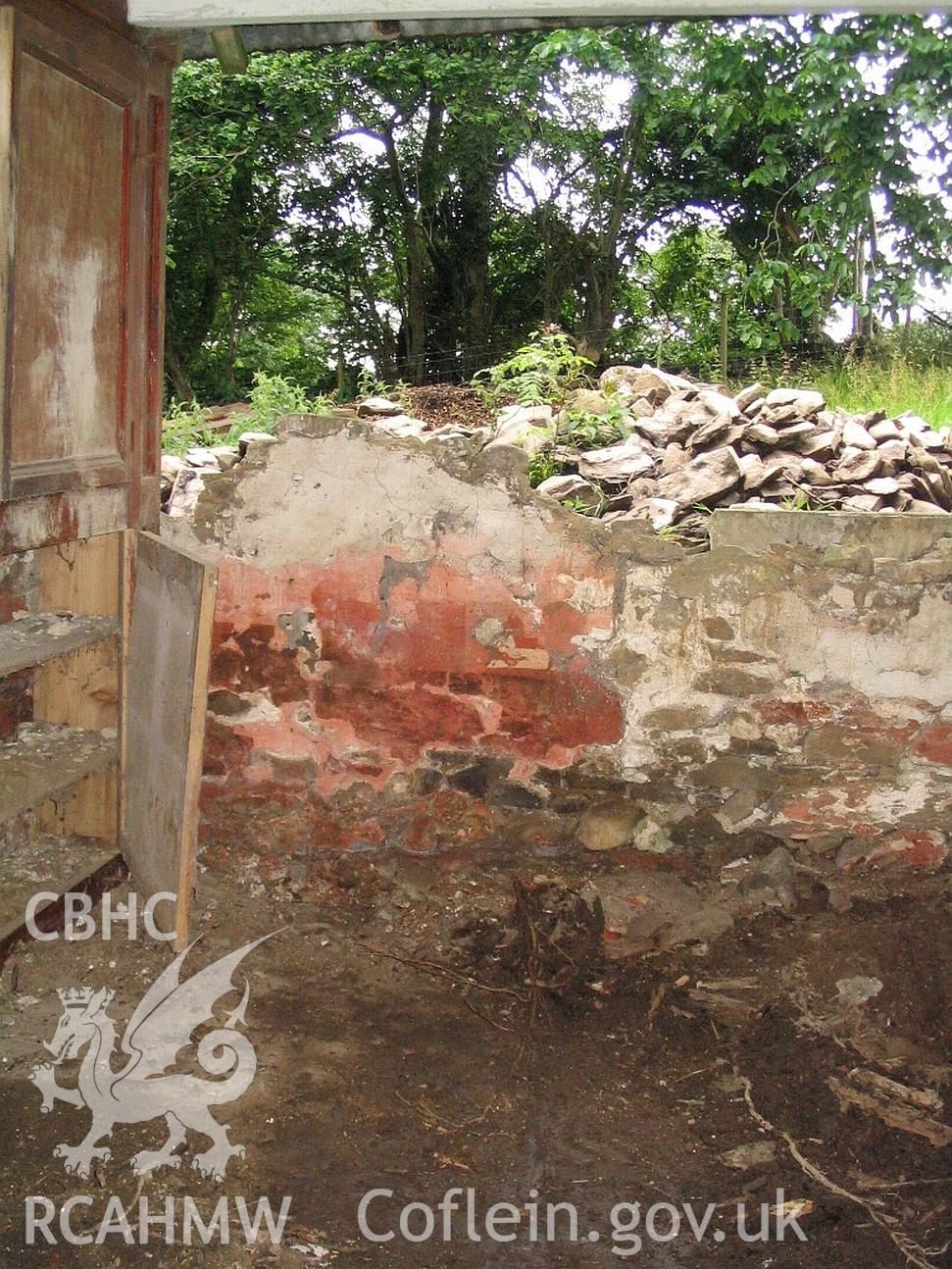 Dwelling end of Allt Ddu farmhouse, dwelling interior, semi collapsed wall.