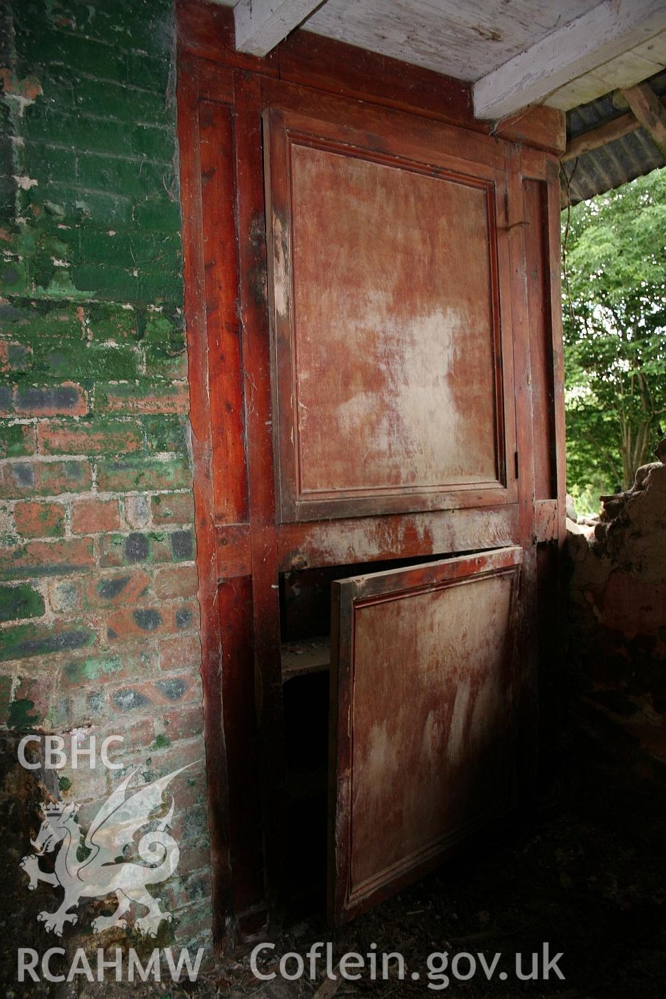 Dwelling end of Allt Ddu farmhouse, brick range and dry cupboard in main fireplace.