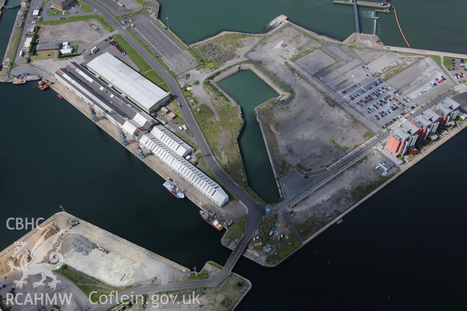 Swansea docks including the Prince of Wales dry dock. Oblique aerial photograph taken during the Royal Commission's programme of archaeological aerial reconnaissance by Toby Driver on 19th June 2015.