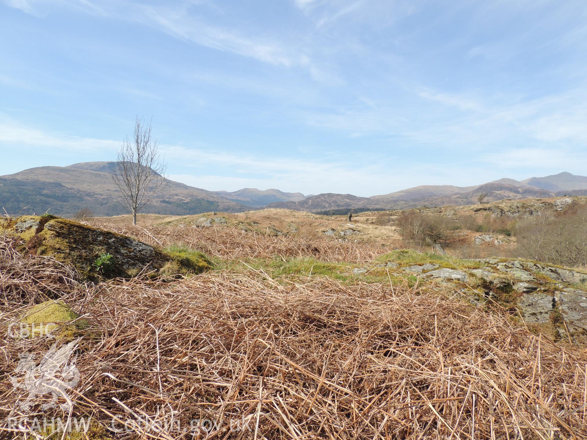 'View towards penstock route from SH62096 43897. Looking east south-east.' Photographed as part of desk based assessment and heritage impact assessment of a hydro scheme on the Afon Croesor, Brondanw Estate, Gwynedd. Produced by Archaeology Wales, 2018.
