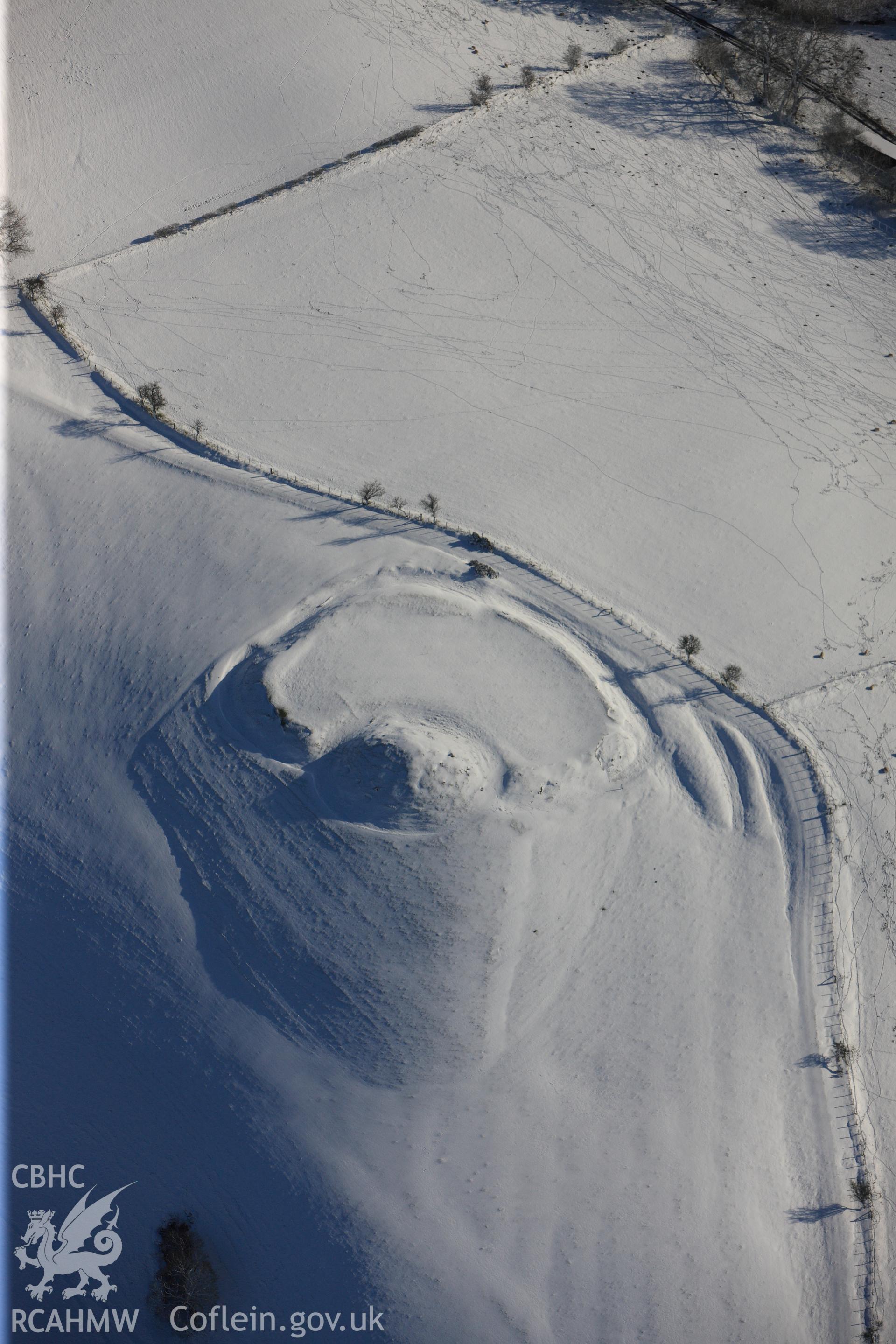 Castell Crugerydd motte and bailey, south east of Llandrindod Wells. Oblique aerial photograph taken during the Royal Commission?s programme of archaeological aerial reconnaissance by Toby Driver on 15th January 2013.