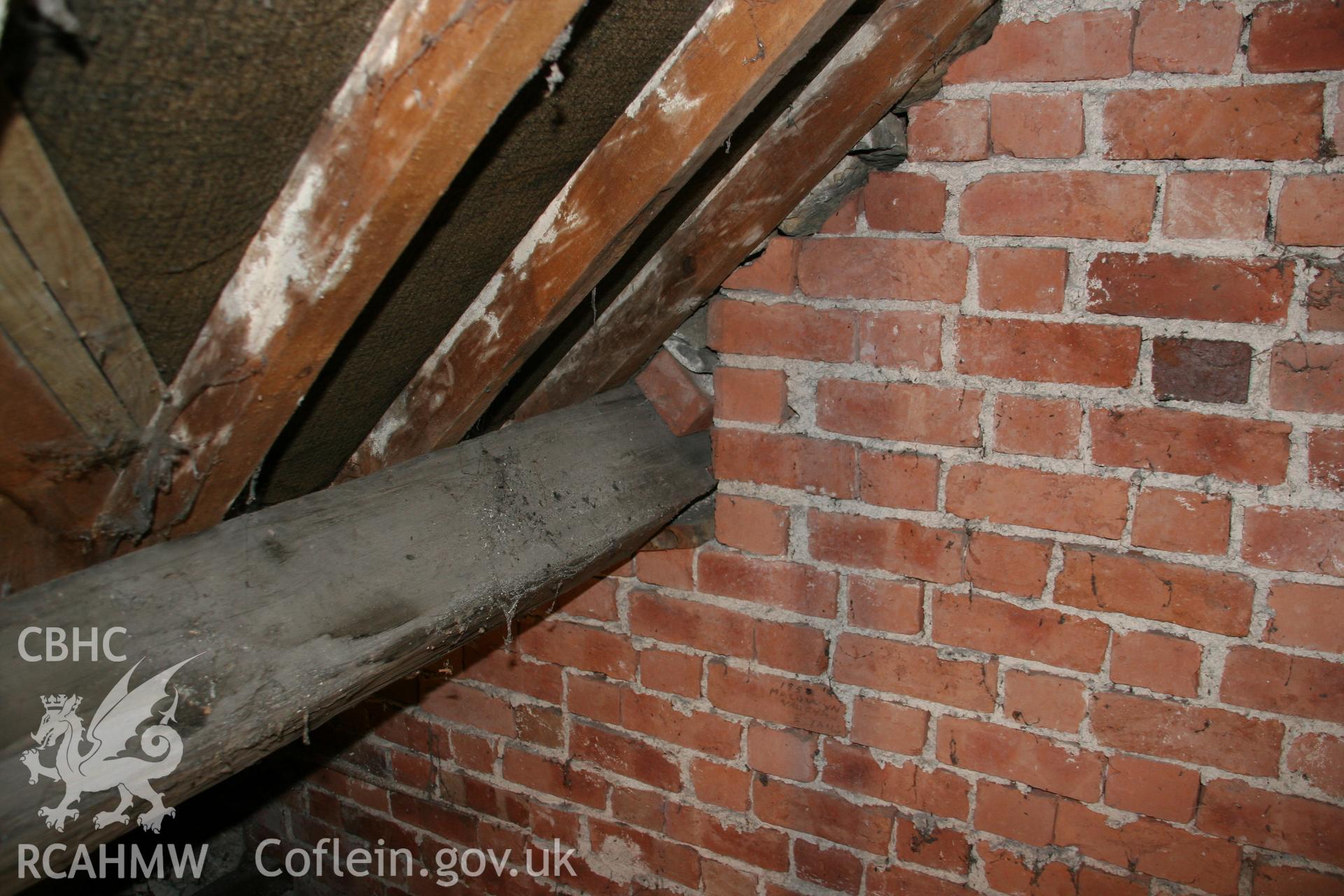 Photograph showing detailed interior view of brick wall, wooden beams and roof of former Llawrybettws Welsh Calvinistic Methodist chapel, Glanyrafon, Corwen. Produced by Tim Allen on 27th February 2019 to meet a condition attached to planning application.
