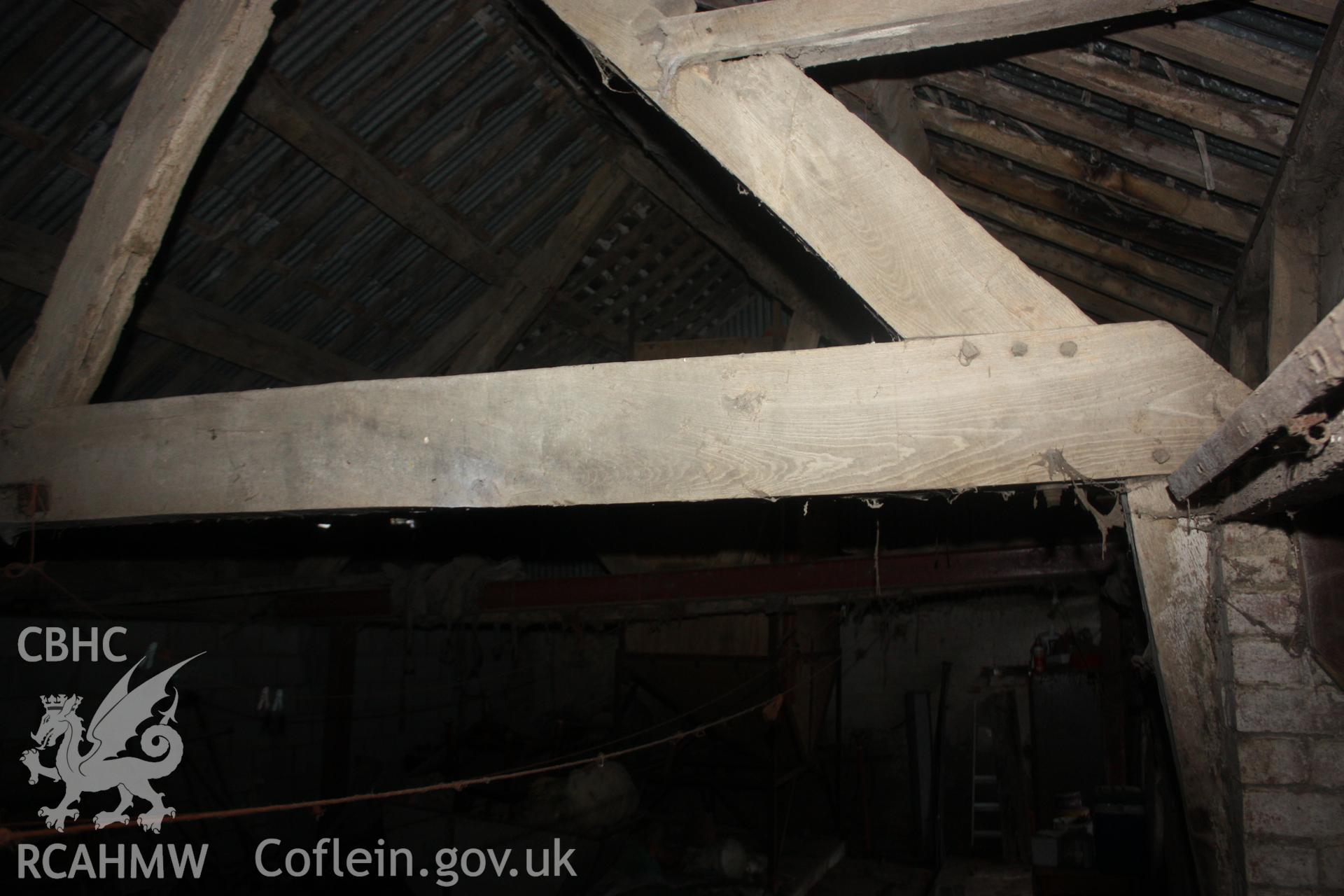 Interior view of barn or shed showing timber building frame and corrugated iron roof. Photographic survey of Glanhafon-Fawr Farmstead conducted by Geoff Ward on 4th November 2010.