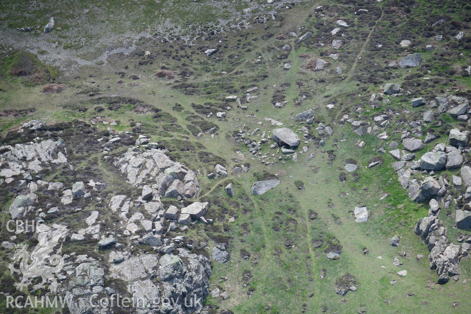 Coetan Arthur burial chamber, St. David's Head. Oblique aerial photograph taken during the Royal Commission's programme of archaeological aerial reconnaissance by Toby Driver on 13th May 2015.