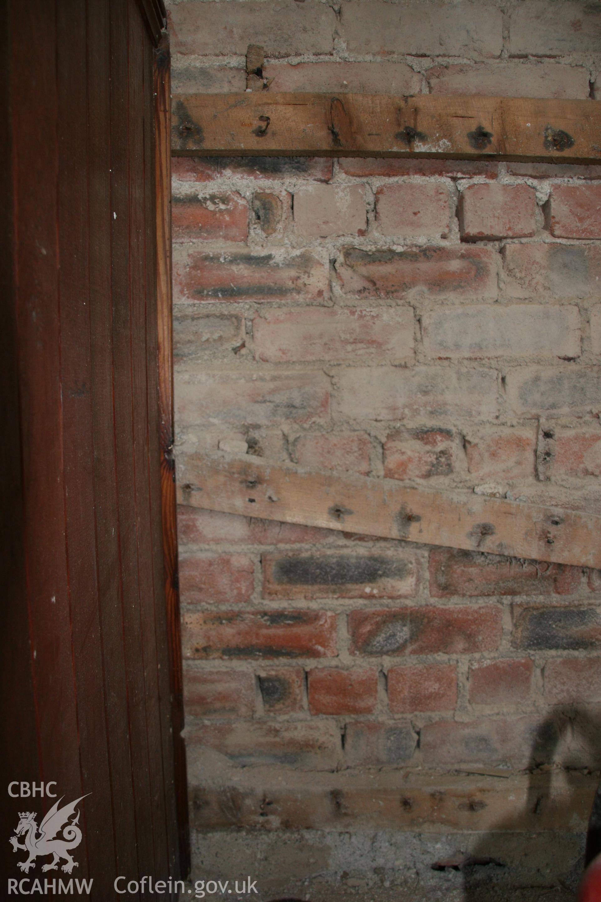 Photograph of internal brickwork behind vertical dado panelling in vestry at the former Llawrybettws Welsh Calvinistic Methodist chapel, Glanyrafon, Corwen. Produced by Tim Allen on 28th February 2019 to meet a condition attached to planning application.