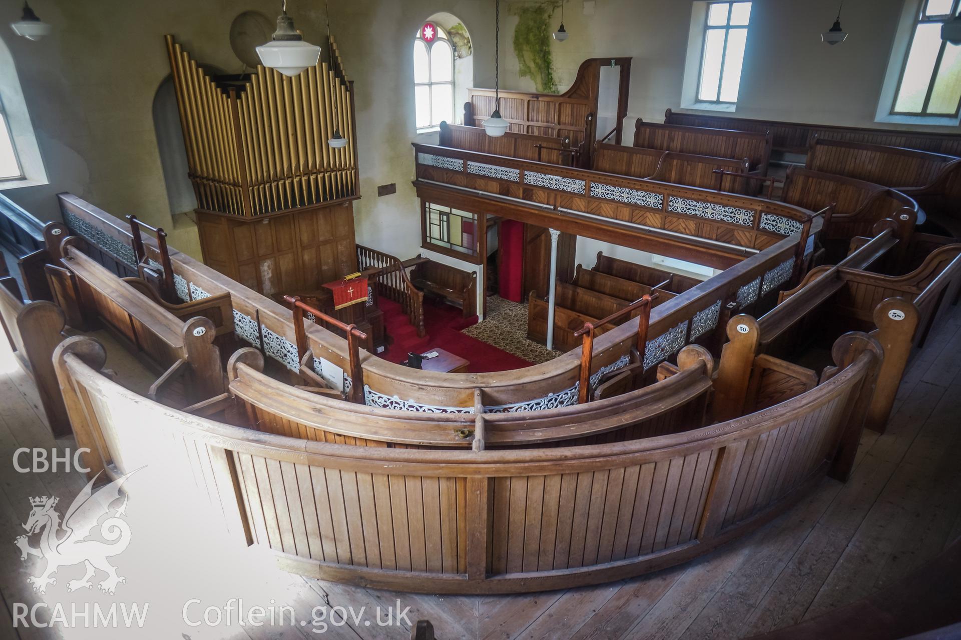 Digital colour photograph showing view of the pulpit and organ pipes from the rear of the first floor gallery at Pentower Chapel, Fishguard, dated 2019. Photographed by Grace Elliott to meet a condition attached to a planning application.