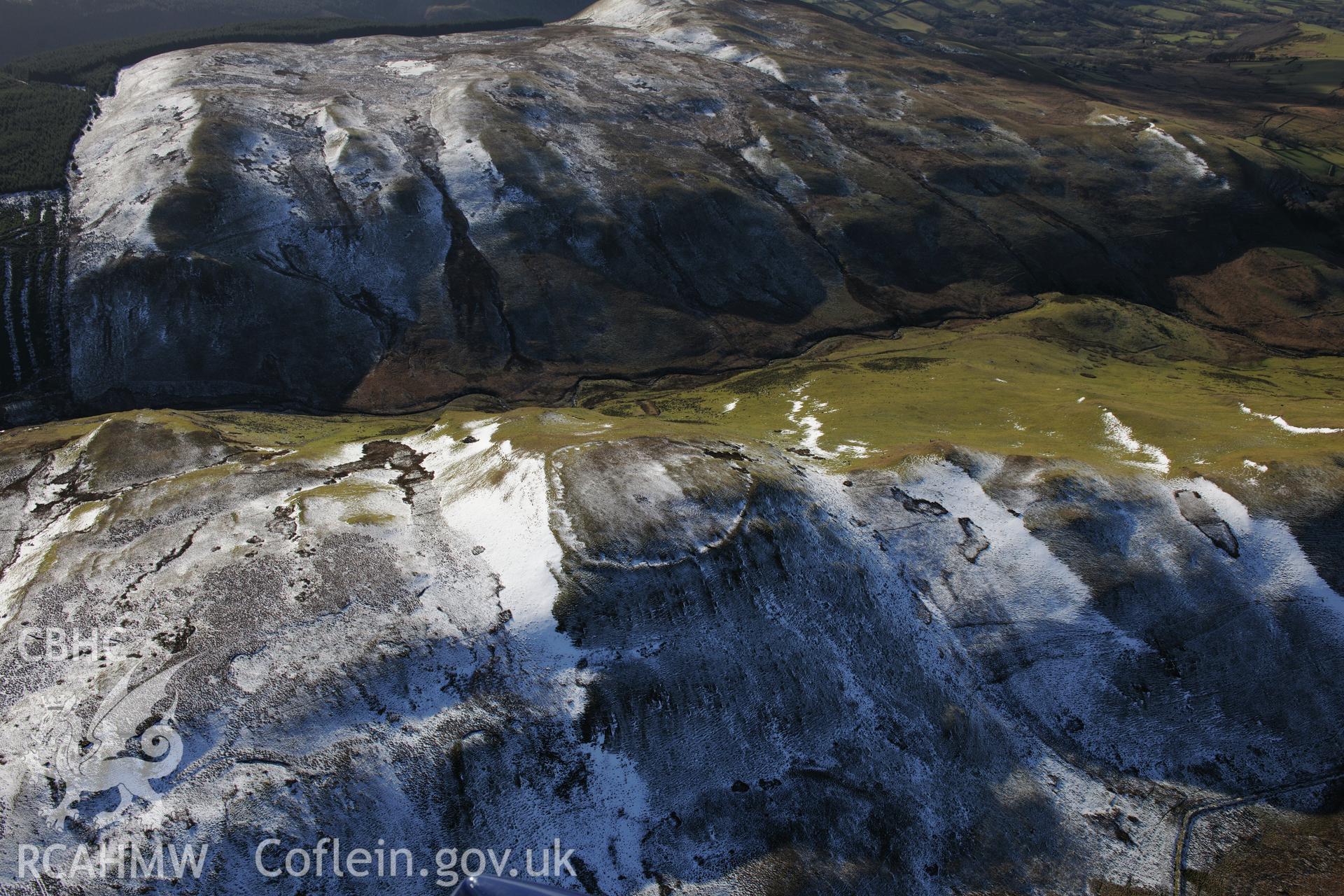 Castell Rhyfel hillfort, east of Tregaron. Oblique aerial photograph taken during the Royal Commission's programme of archaeological aerial reconnaissance by Toby Driver on 4th February 2015.