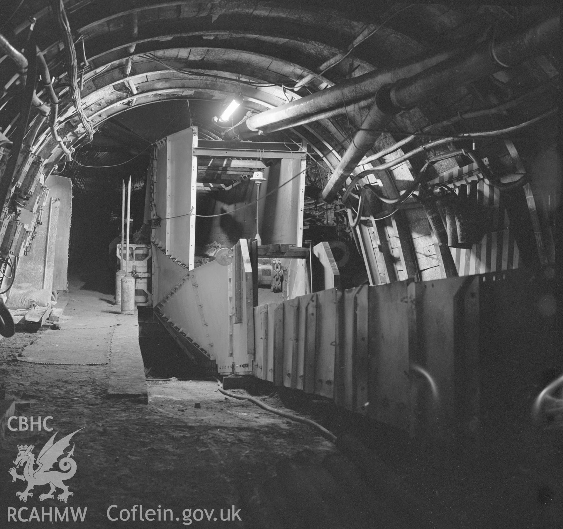 Digital copy of an acetate negative showing lump breaker on conveyor at Taff Colliery, from the John Cornwell Collection.