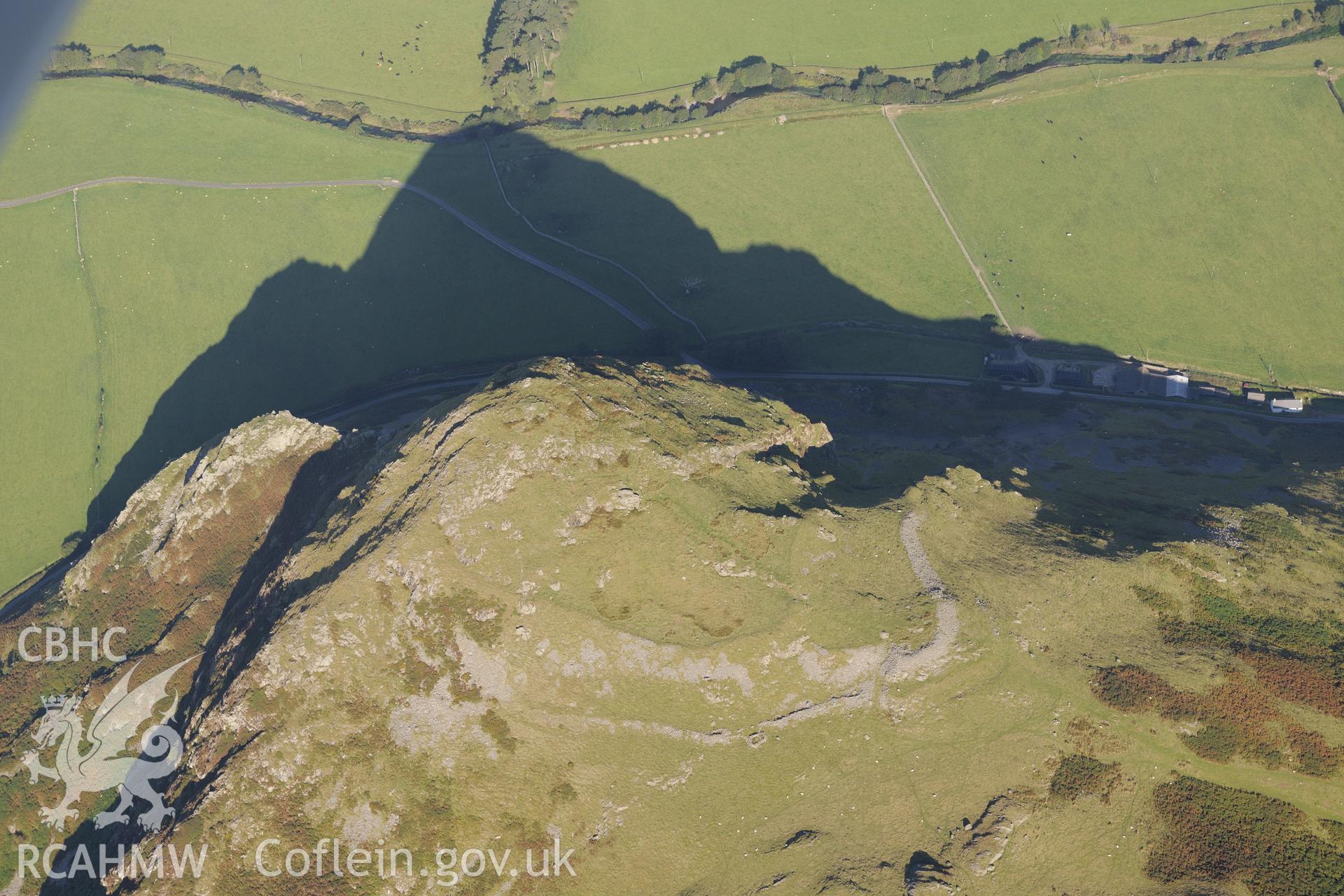 Hillfort on Bird's Rock, near Abergynolwyn. Oblique aerial photograph taken during the Royal Commission's programme of archaeological aerial reconnaissance by Toby Driver on 2nd October 2015.