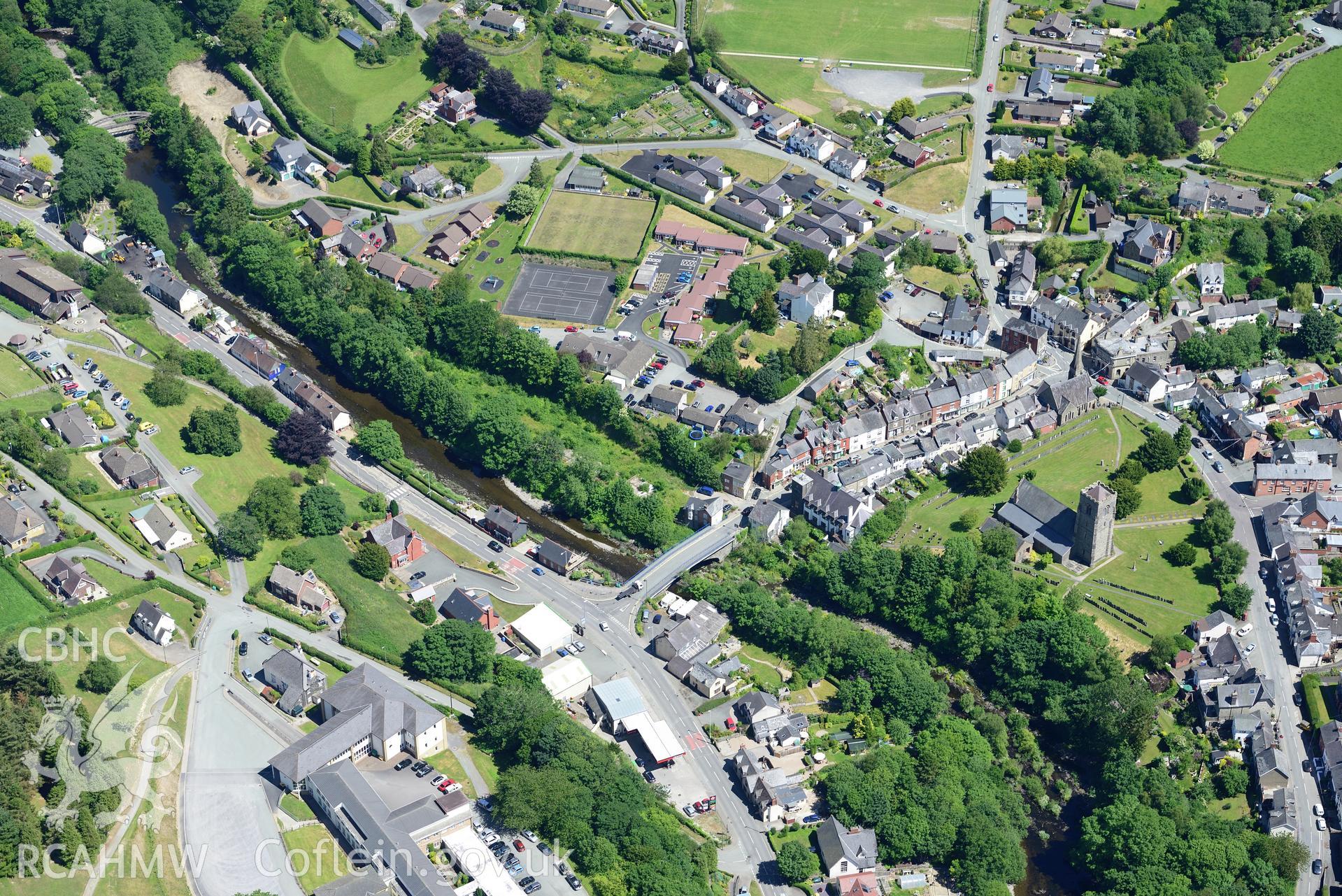 St. Mary's church and Llanfair bridge in the town of Llanfair Caereinion, west of Welshpool. Oblique aerial photograph taken during the Royal Commission's programme of archaeological aerial reconnaissance by Toby Driver on 30th June 2015.