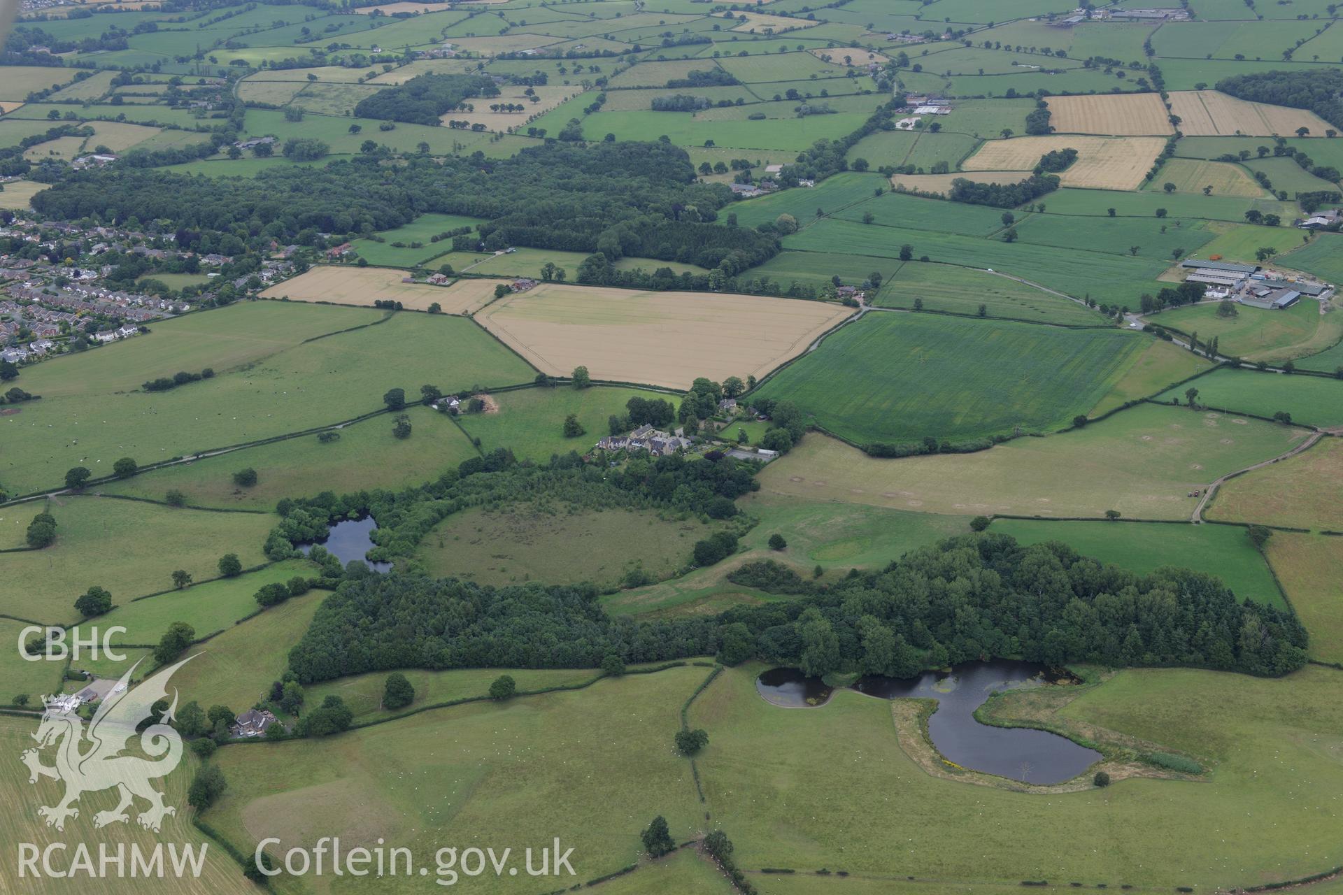 Landscape view with the village of Gresford, Wrexham, in the background. Oblique aerial photograph taken during the Royal Commission's programme of archaeological aerial reconnaissance by Toby Driver on 30th July 2015.