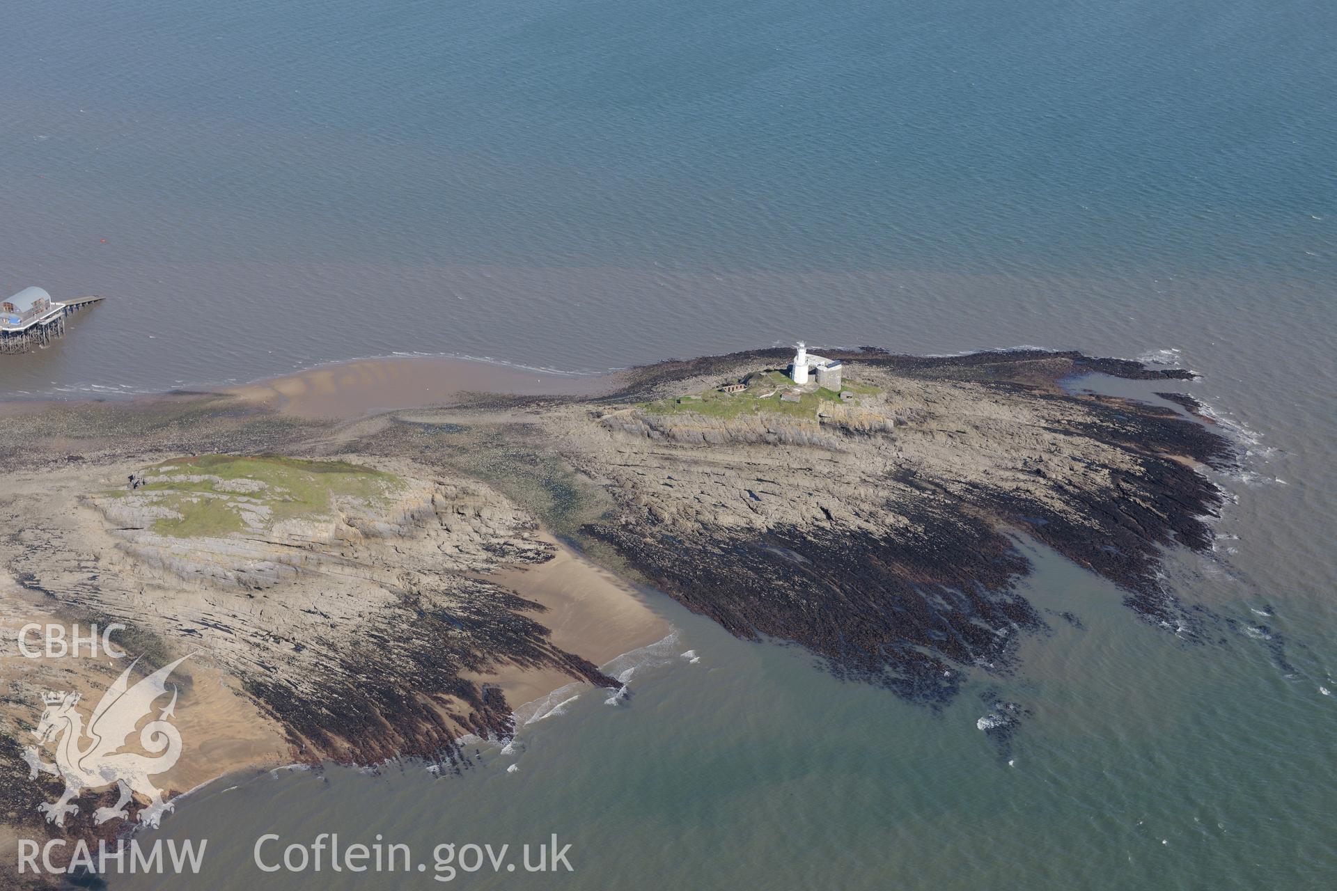 Mumbles fort, a coast artillery searchlight and Mumbles lighthouse on the south western edge of Swansea Bay. Oblique aerial photograph taken during the Royal Commission's programme of archaeological aerial reconnaissance by Toby Driver on 30/09/2015.
