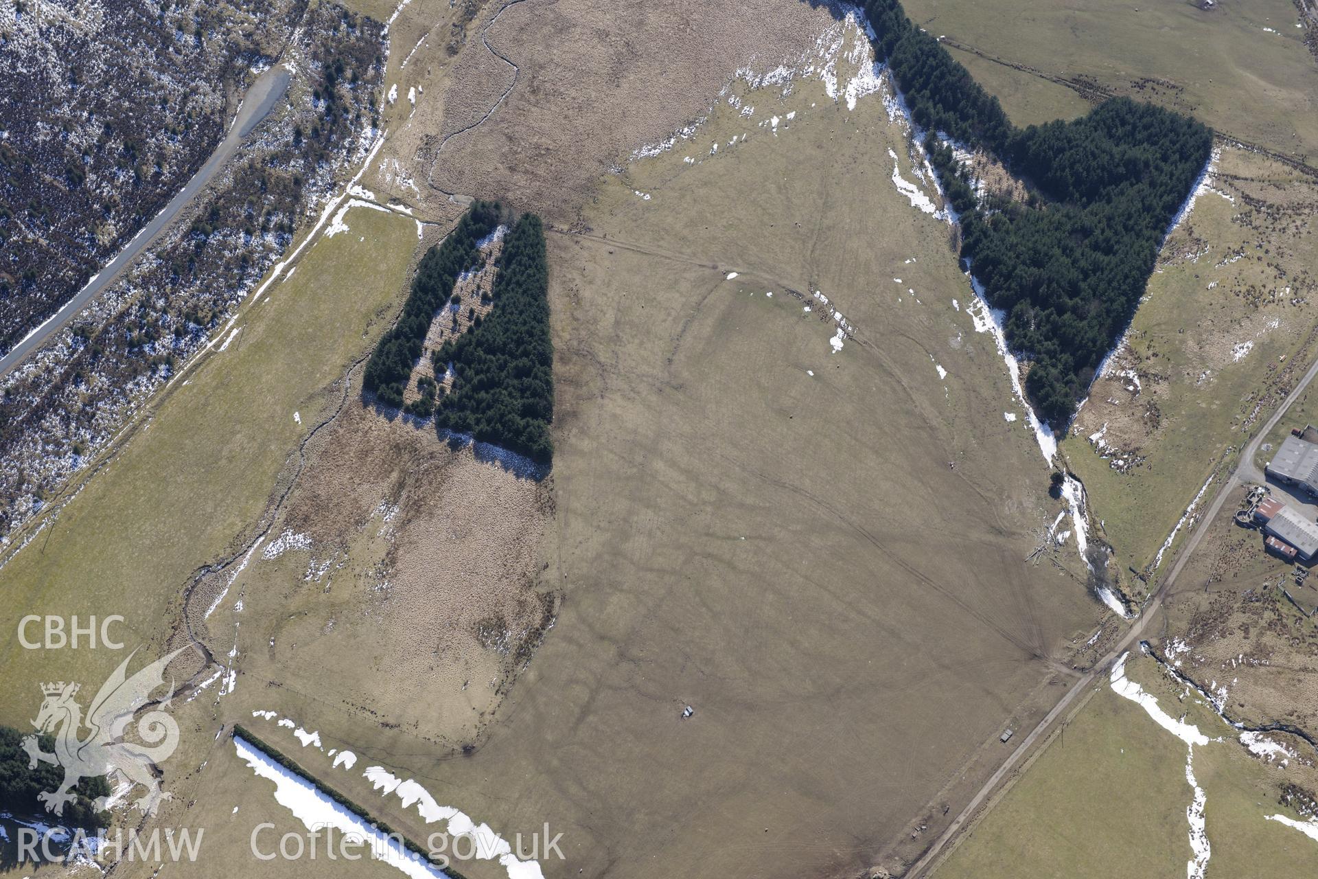 Llys Arthur defended enclosure, north east of Ponterwyd. Oblique aerial photograph taken during the Royal Commission's programme of archaeological aerial reconnaissance by Toby Driver on 2nd April 2013.