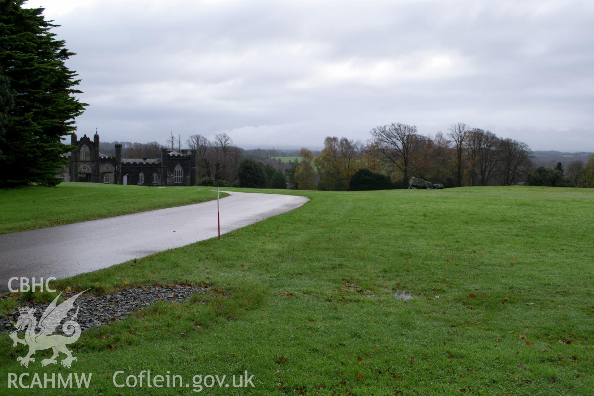 General view looking north west along carriage drive showing burial chamber and stables. Photographed during archaeological watching brief of Plas Newydd, Ynys Mon, conducted by Gwynedd Archaeological Trust on 14th November 2017. Project no. 2542.