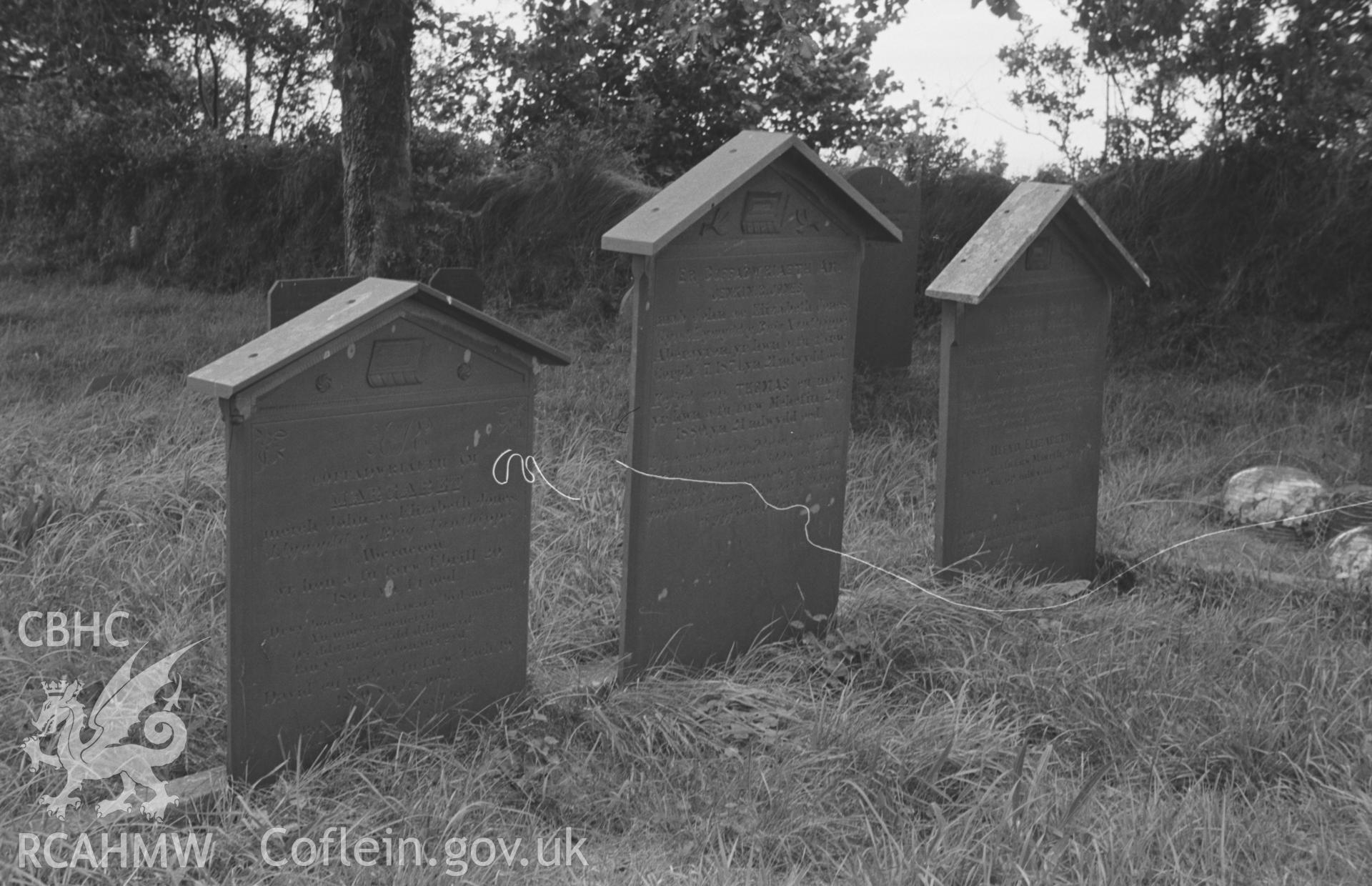 Digital copy of a black and white negative showing gravestones at St. David's Church, Henfynyw, Aberaeron. Photographed by Arthur O. Chater on 5th September 1966 from Grid Reference SN 447 613.