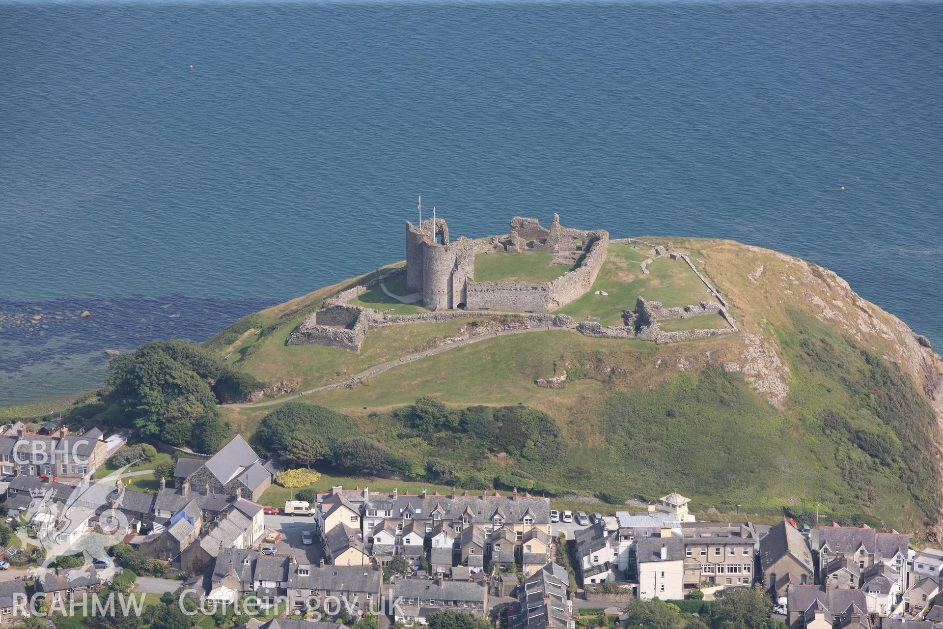 Criccieth Castle, overlooking the town of Criccieth. Oblique aerial photograph taken during the Royal Commission?s programme of archaeological aerial reconnaissance by Toby Driver on 12th July 2013.