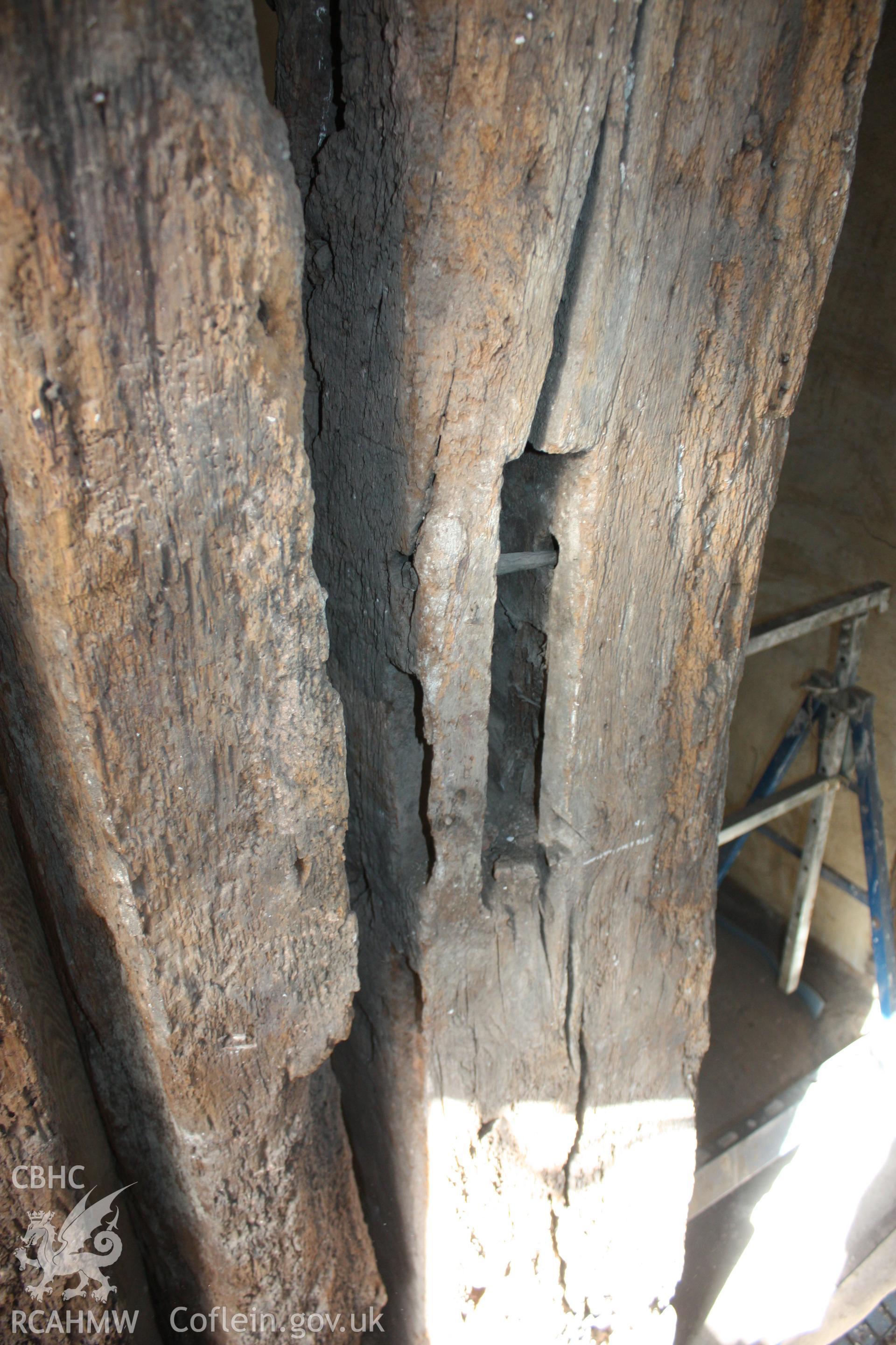 Colour photograph of detail of timber hall post at Porth-y-Dwr, 67 Clwyd Street, Ruthin. Photographed during survey conducted by Geoff Ward on 10th June 2013.