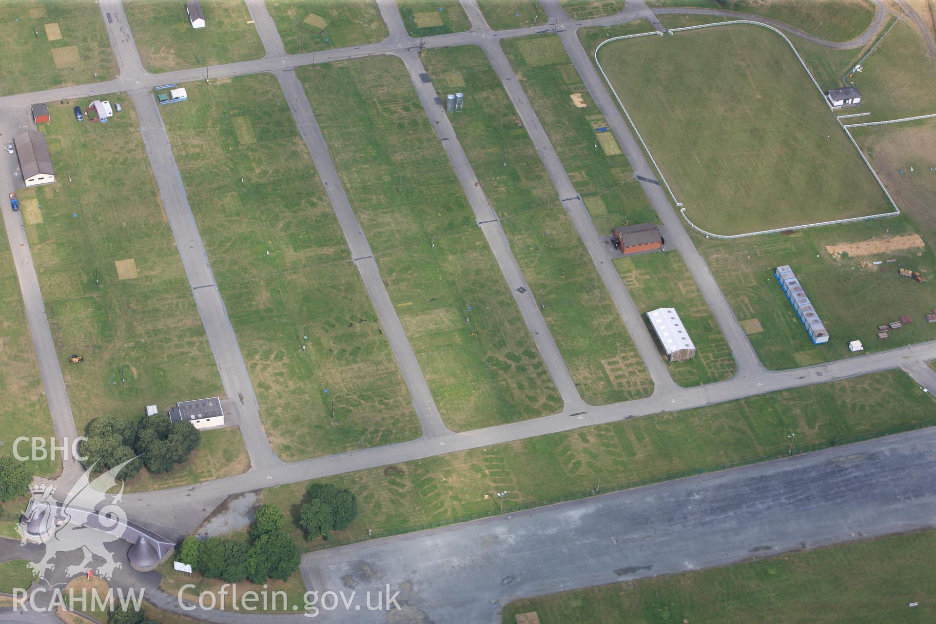 The Royal Welsh Showground, Llanelwedd. Oblique aerial photograph taken during the Royal Commission?s programme of archaeological aerial reconnaissance by Toby Driver on 1st August 2013.