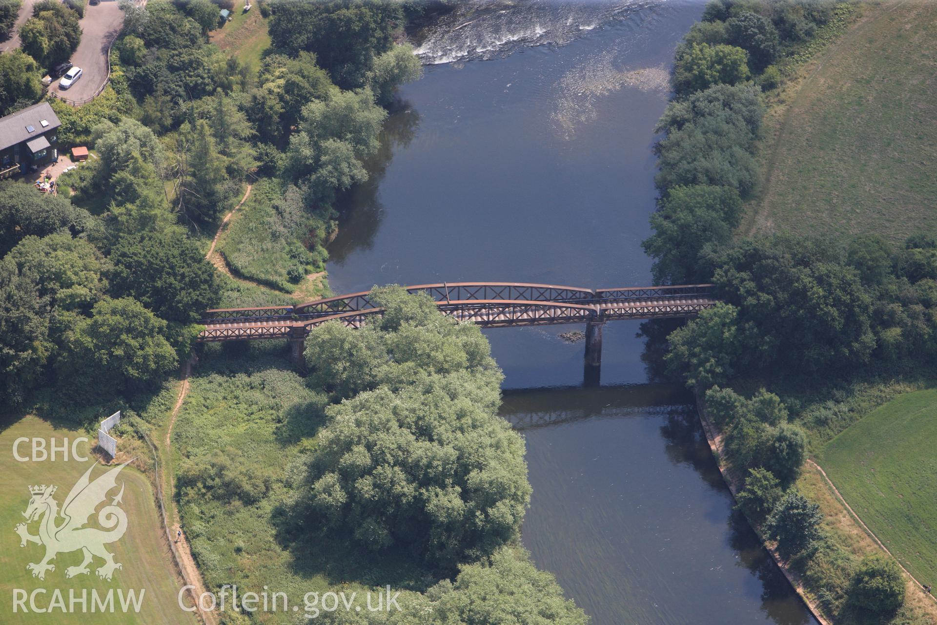 The Duke of Beaufort Bridge crossing the river Wye, on the south eastern outskirts of Monmouth. Oblique aerial photograph taken during the Royal Commission?s programme of archaeological aerial reconnaissance by Toby Driver on 1st August 2013.