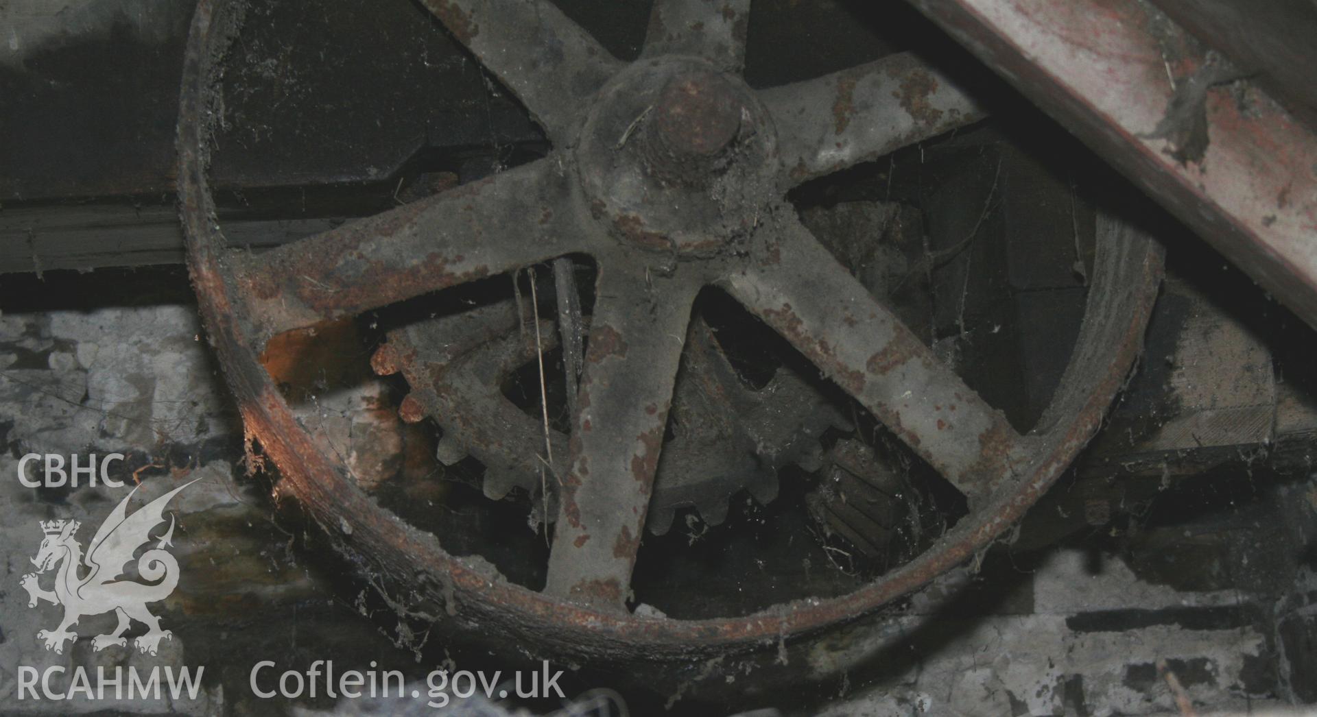 Detail of iron cogs on threshing machine. Photographic survey of the threshing machine in the threshing house at Tan-y-Graig Farm, Llanfarian. Conducted by Geoff Ward and John Wiles 11th December 2016.